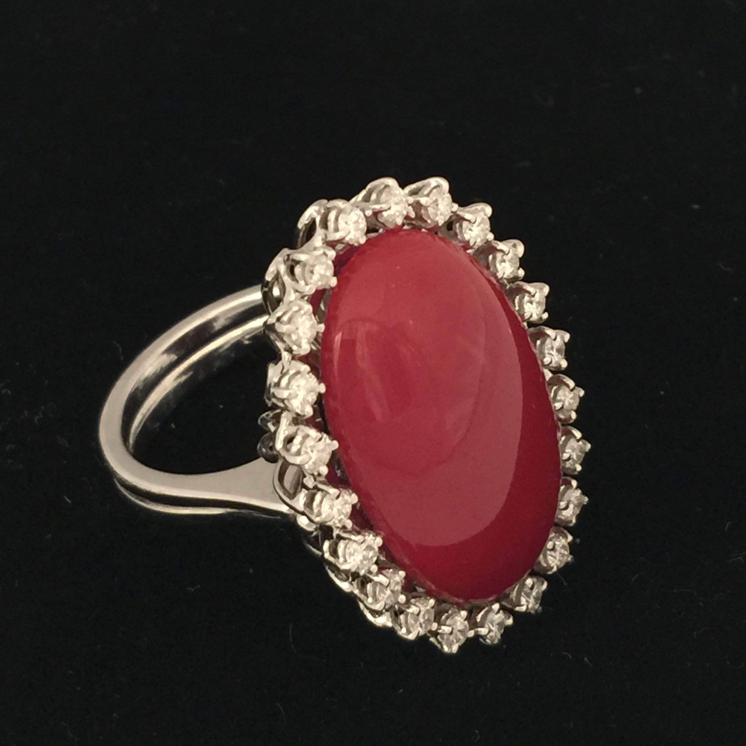 A stunning oxblood coral and diamond cocktail ring. 

The ring features a  beautiful deep red 