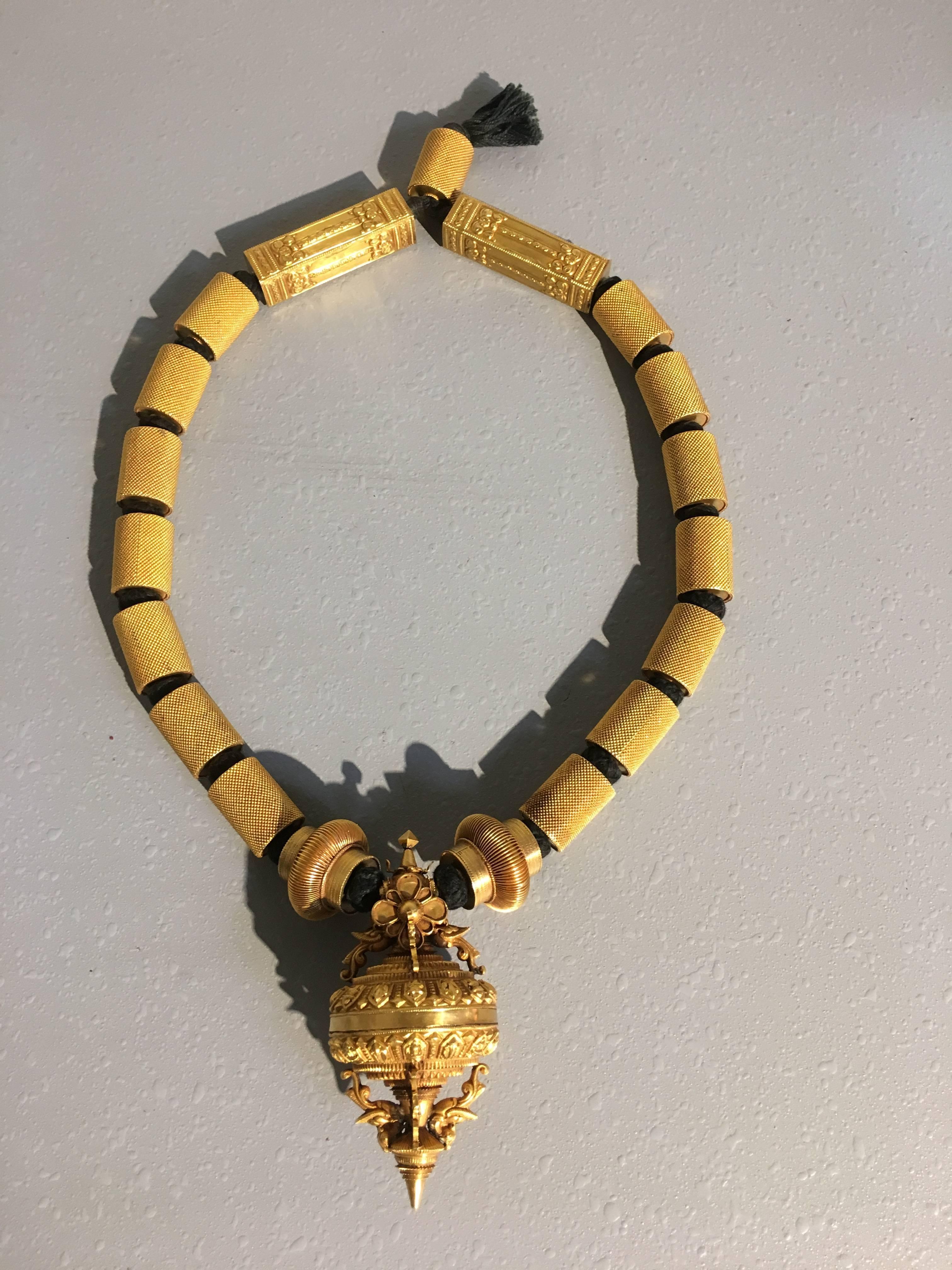 An incredible marriage necklace from the Chettiar community of Tamil Nadu, India. 
This necklace seems to have been restrung, as it is missing the finger thali pendants that would serve as the main decorative elements for the necklace. The current