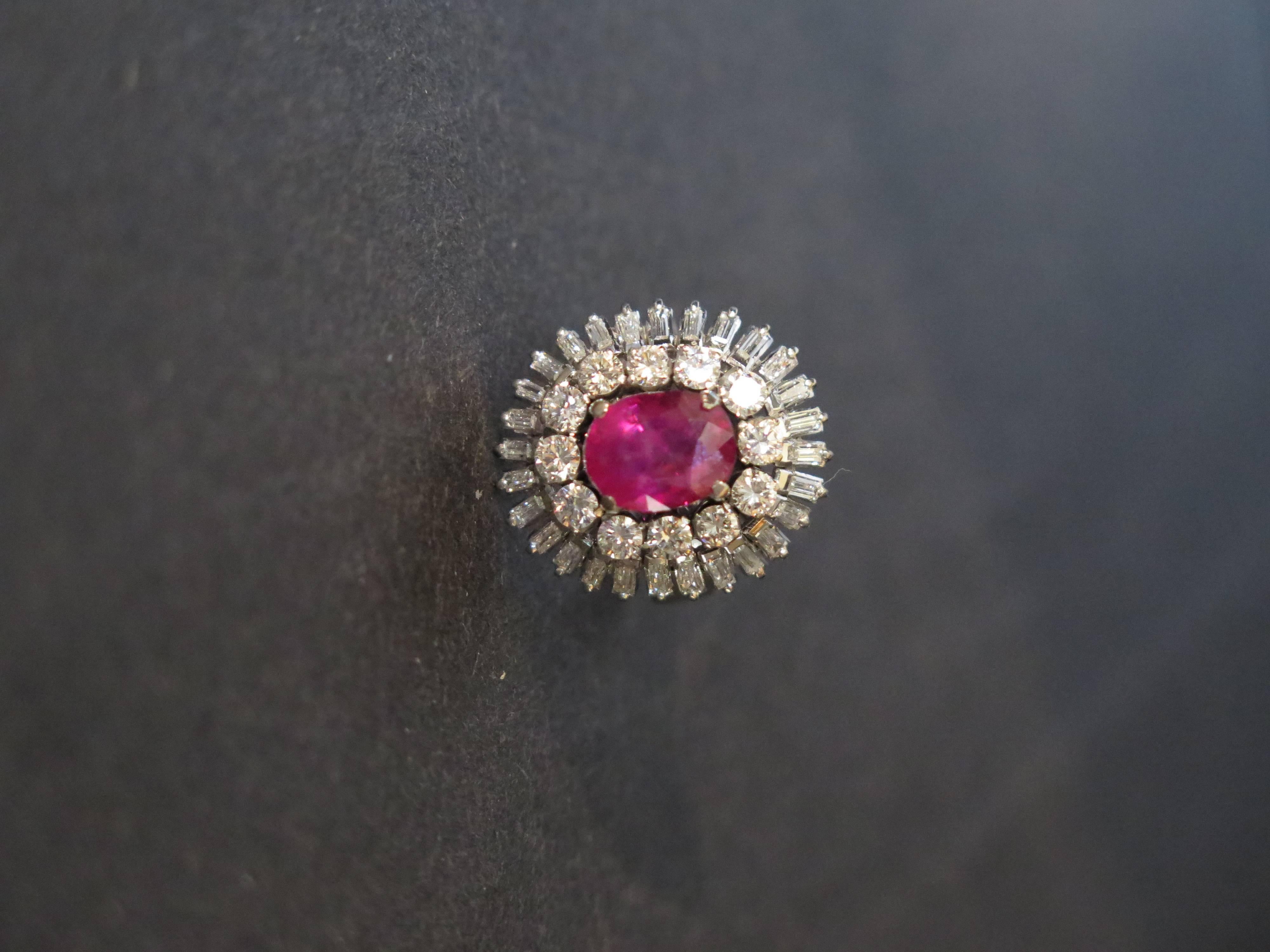 An AGL certified  Burmese natural, non heated oval mixed cut 2.64 carats ruby surrounded by 2,25 carats of round cut and baguette cut diamonds in ballerina white gold setting. Ruby is highly saturated.
Ring size 5.5. 10K white gold. 7.3 grams.

