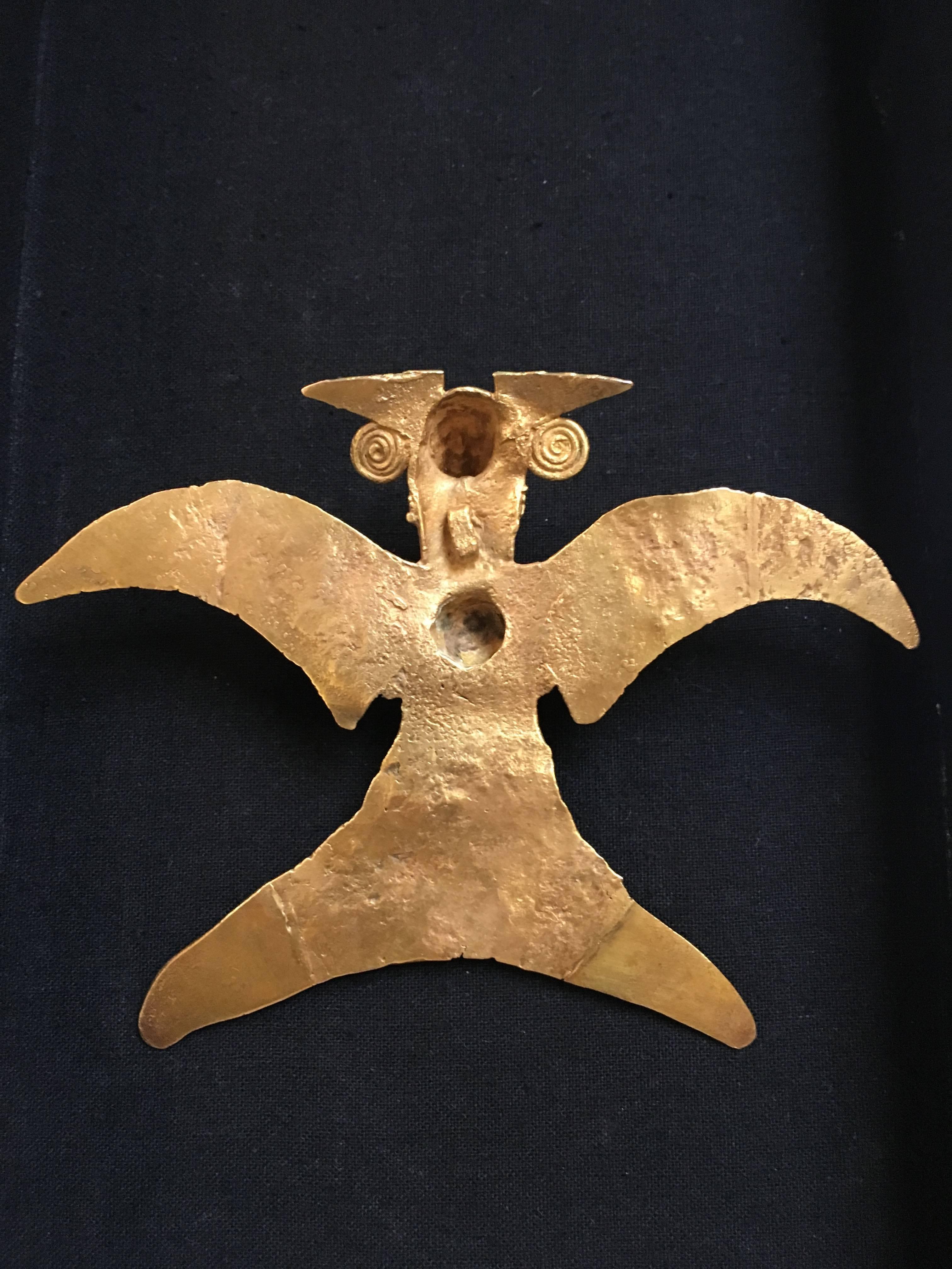 A stunning, large, 22k cast gold pendant in the shape of an eagle, Veraguas culture, Panama, circa 900 to 1200 AD. 
The large pendant cast in 22k gold using the lost wax technique. The eagle with wings outspread in a dramatic fashion, with taloned