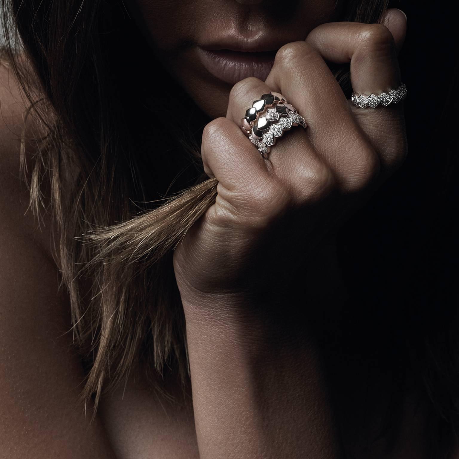 18K Rose Gold AKILLIS Python ring half-set with White diamonds 
Diamonds (cts): 0,3 
 
With the Python collection AKILLIS takes the bold graphic power of snake scales and weaves them into a modern evocation of a tattoo that hugs the skin. Capturing