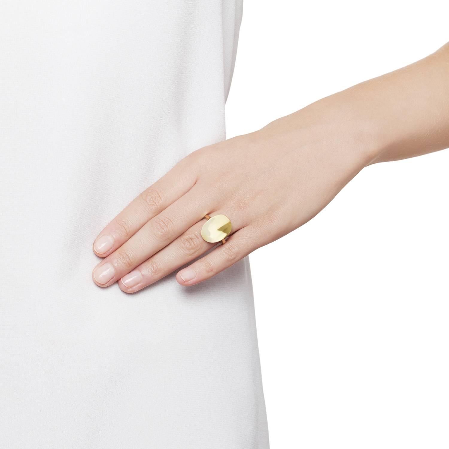 Yellow Gold Sculptural Oval Ring in a pure simple graphic concave form allowing the play of light on the polished surface. The Ellipse design featuring a perfectly balanced concave form that plays with reflections of light from its high mirror