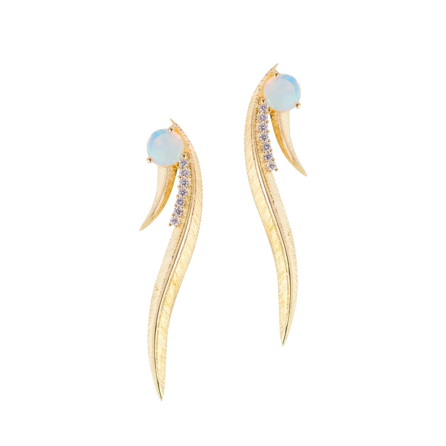 Showpiece Phoenix Ear Climbers are a reworking of a heritage Daou design from the 1970s, once described as ‘Wonder woman earrings!’ both strong and feminine. Accents of hand-selected luminous opals finish the sleek feather design with hand textured