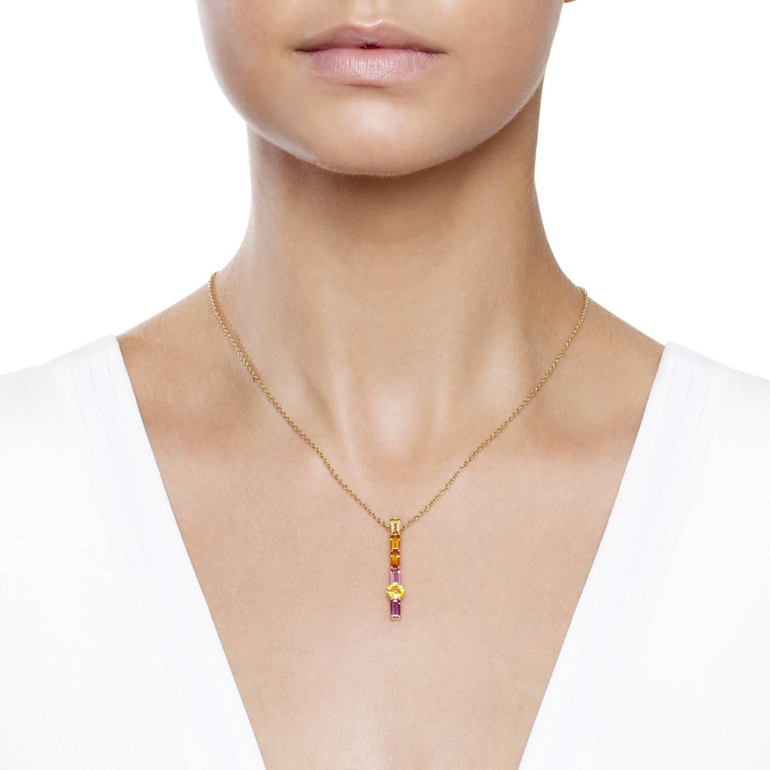Eye-catching simplicity and vibrancy in a fusion of orange yellows, pink and purple hand selected gemstones set beautifully to let light in and diffract all the colours within. Set in yellow gold to highlight the golden warmth and flame like flashes