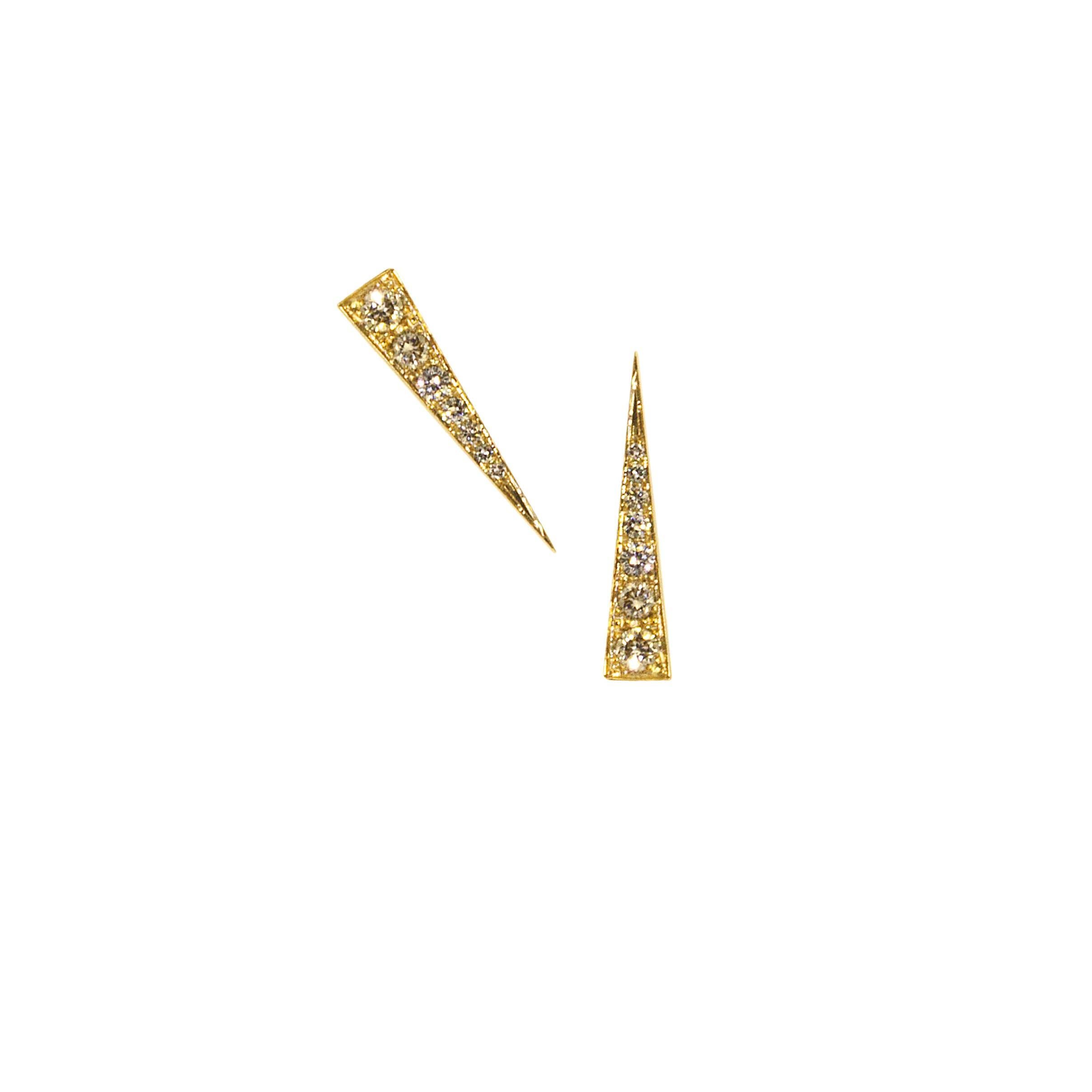 The Spark Earrings are a delicate modern, elegant and refined design, while deceptively simple they can be worn straight down or at an angle as shown, the earrings quietly sparkle. The signature Daou Spark from the collection of delicate stacking