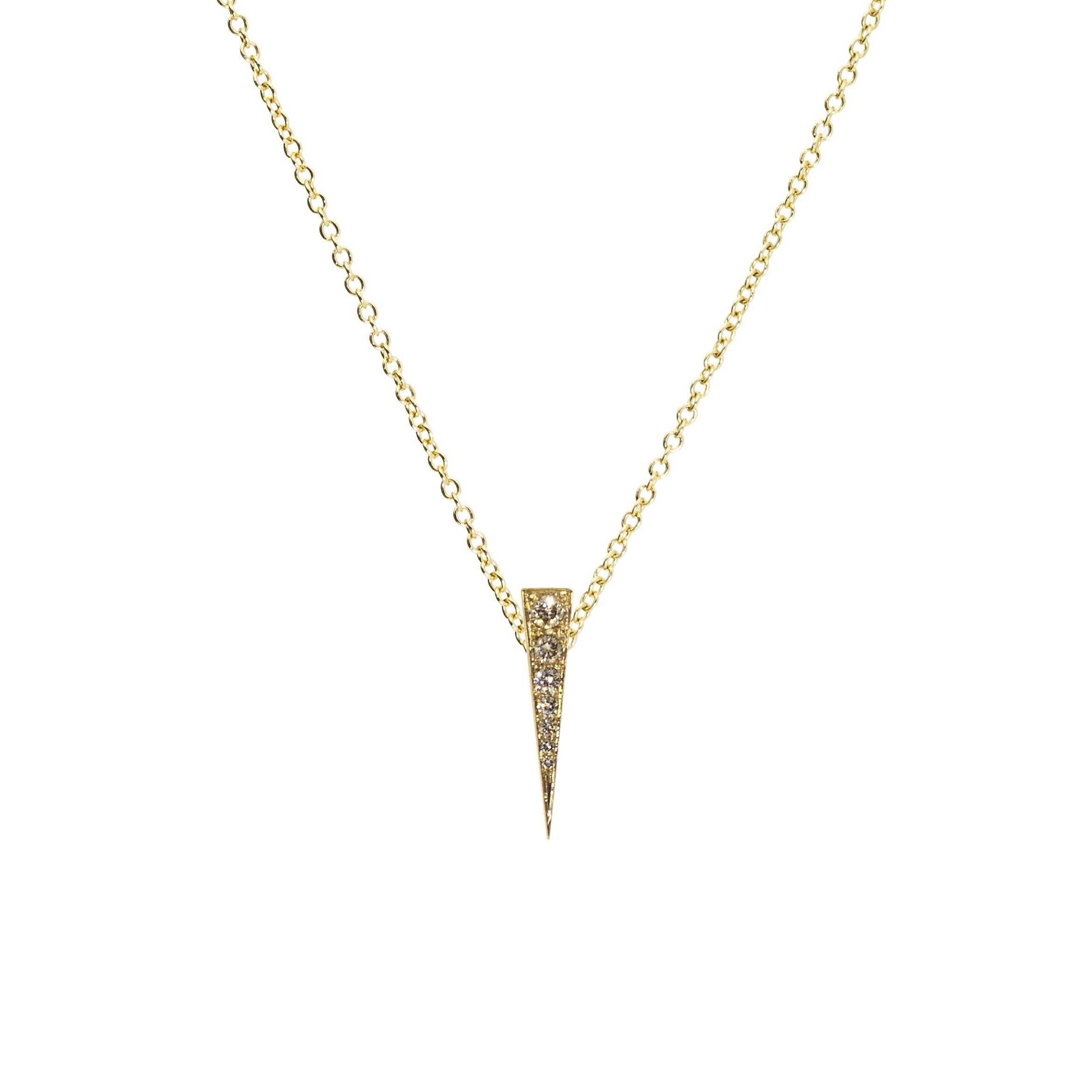 The Spark Pendant in 18 carat Yellow Gold and Diamonds is a delicate modern, elegant and refined design, while deceptively simple it can be worn pointed upwards or downwards. The signature Daou Spark from the collection of delicate stacking rings