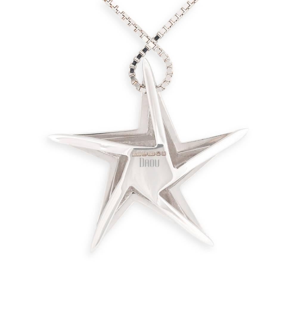 The iconic contemporary Daou star pendant necklace in Sapphire and White Gold in the medium size. The Star collection features geometric Art-Deco inspired Stars in an array of sizes and colours of gold and may be set with your choice of gemstone. An