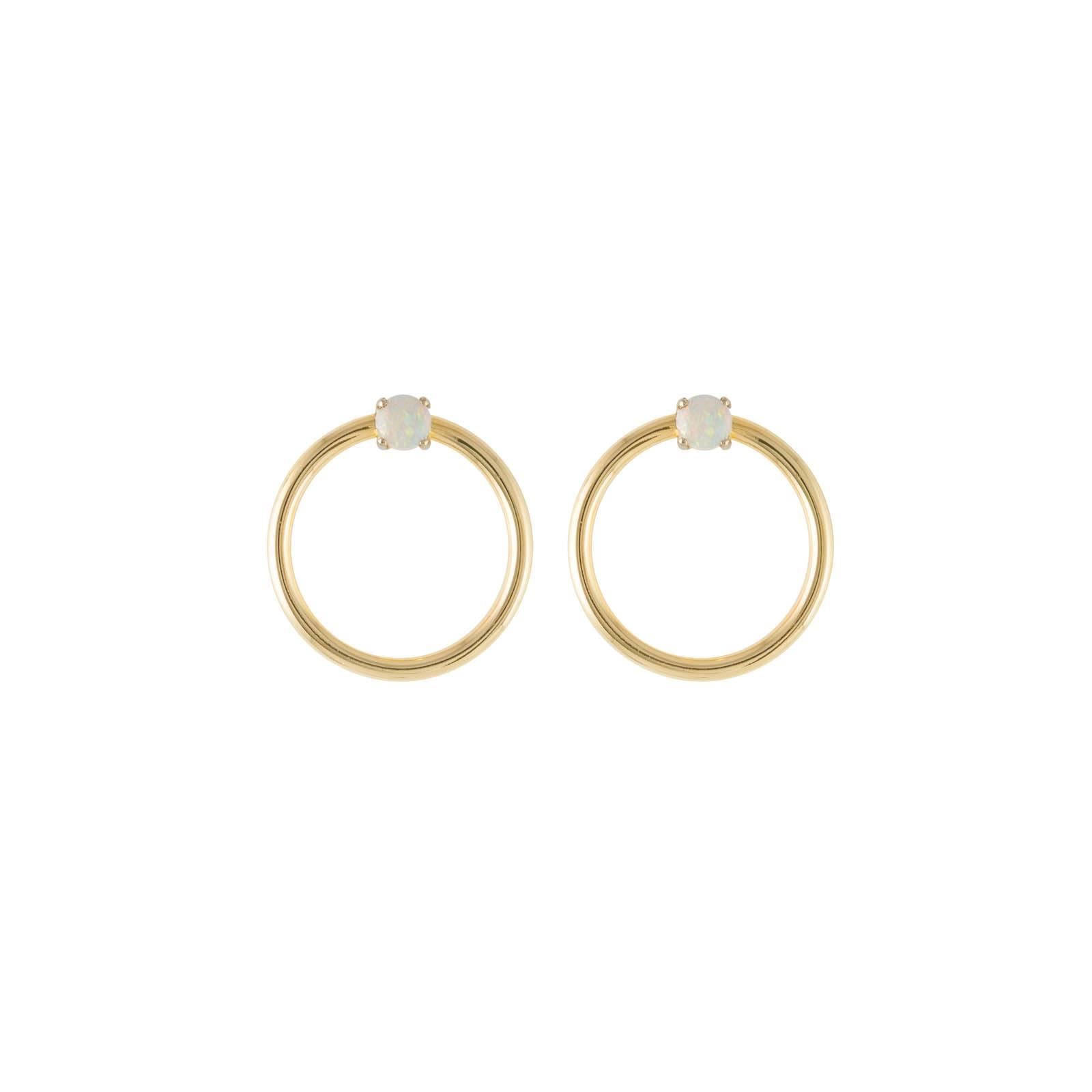 The Opal and yellow gold small front facing hoop earrings and the Large Orbit Hoop Multiplier earring jackets are here sold as a set and offered at a discount. These are simply elegant and chic earrings set with round cabochon opals in yellow gold.