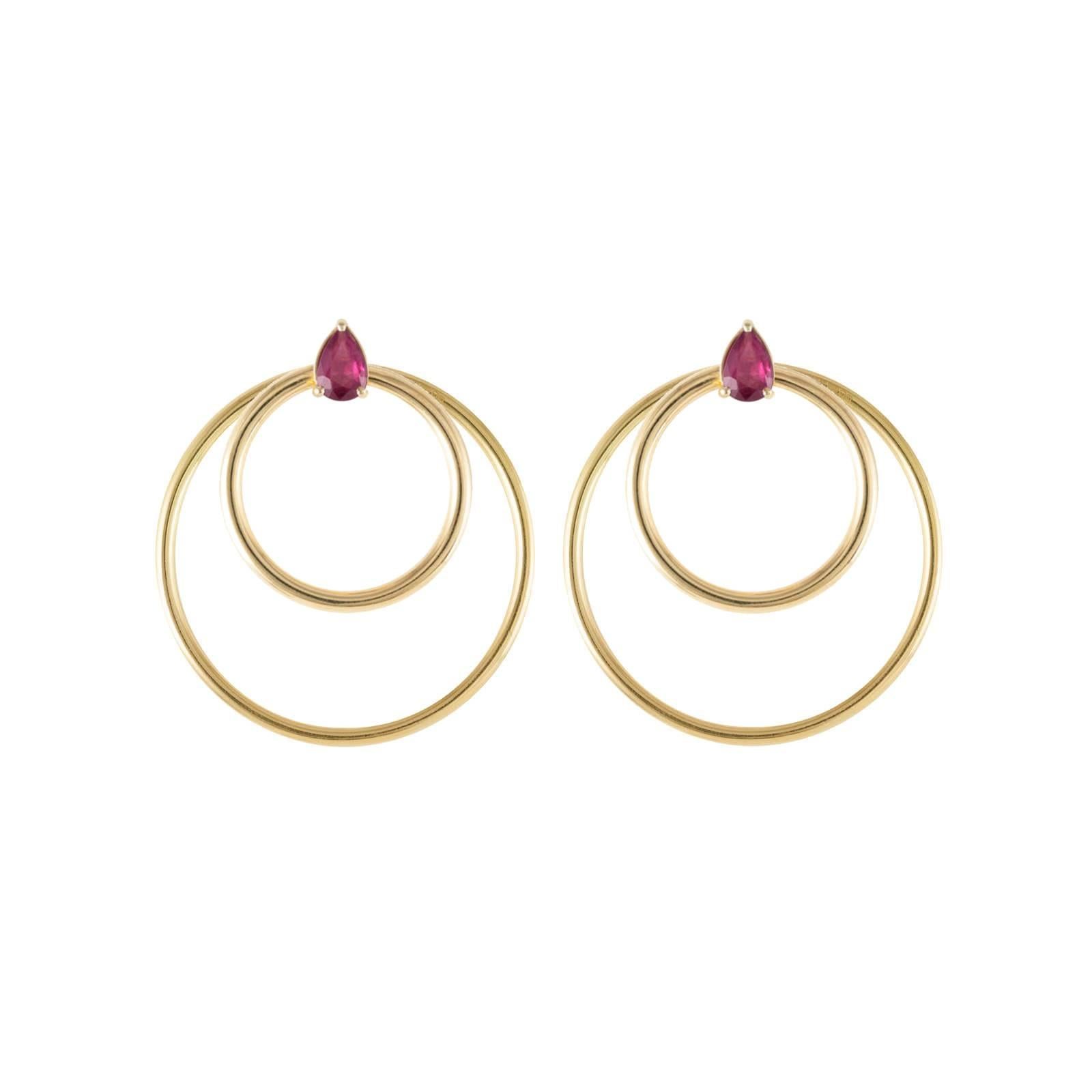 Ruby and yellow gold small front facing hoop earrings and the Large Orbit Hoop Multiplier earring jackets are here sold as a set and offered at a discount. Simple chic earrings set with pear cut rubies in 18 karat yellow gold. Perfectly