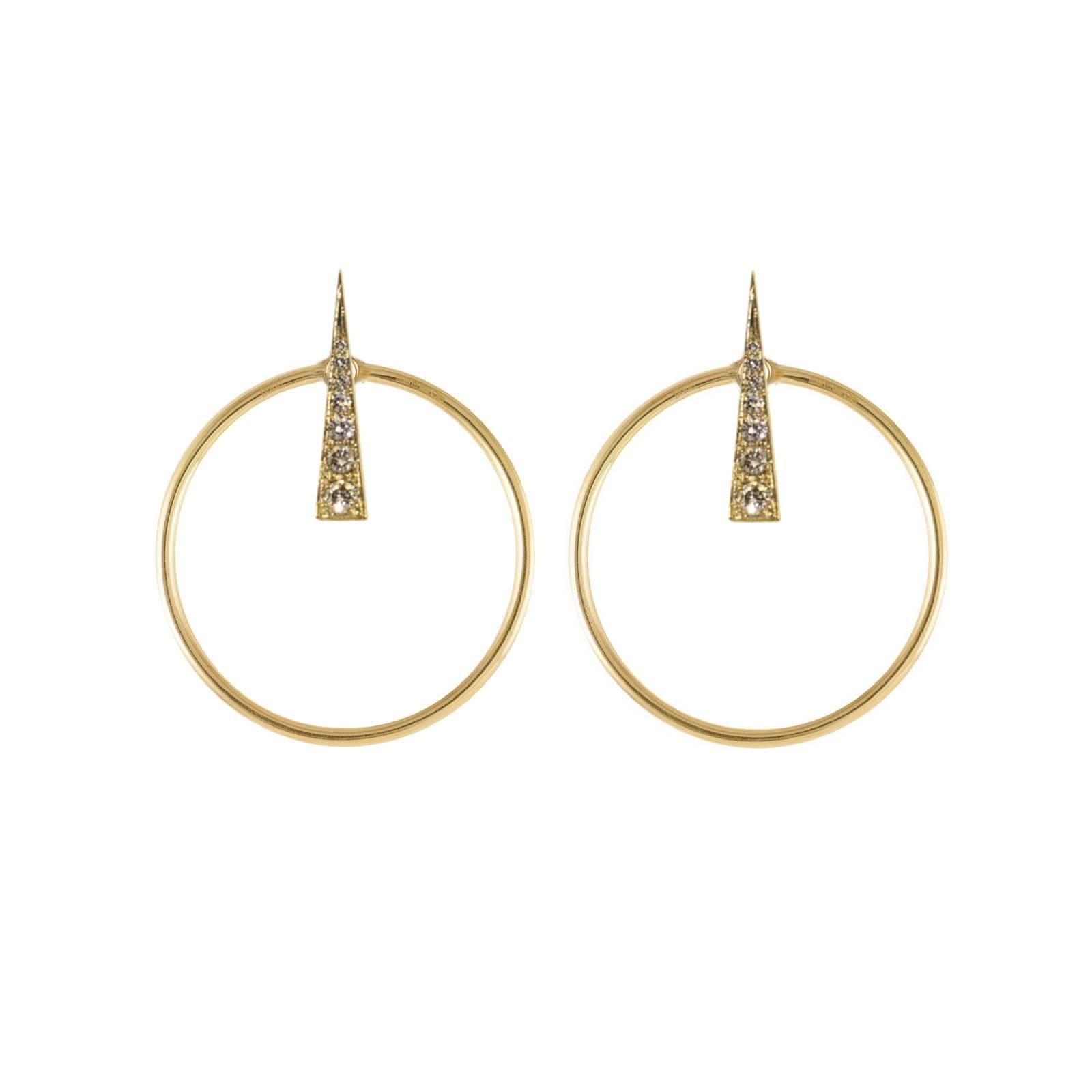 Large Orbit Hoop Multiplier earring jackets in 18 karat yellow gold are an innovative addition to any bar fastening earrings. The front facing hoops slip on to the bar or any earring and immediately create an elegantly balanced hoop frame around the