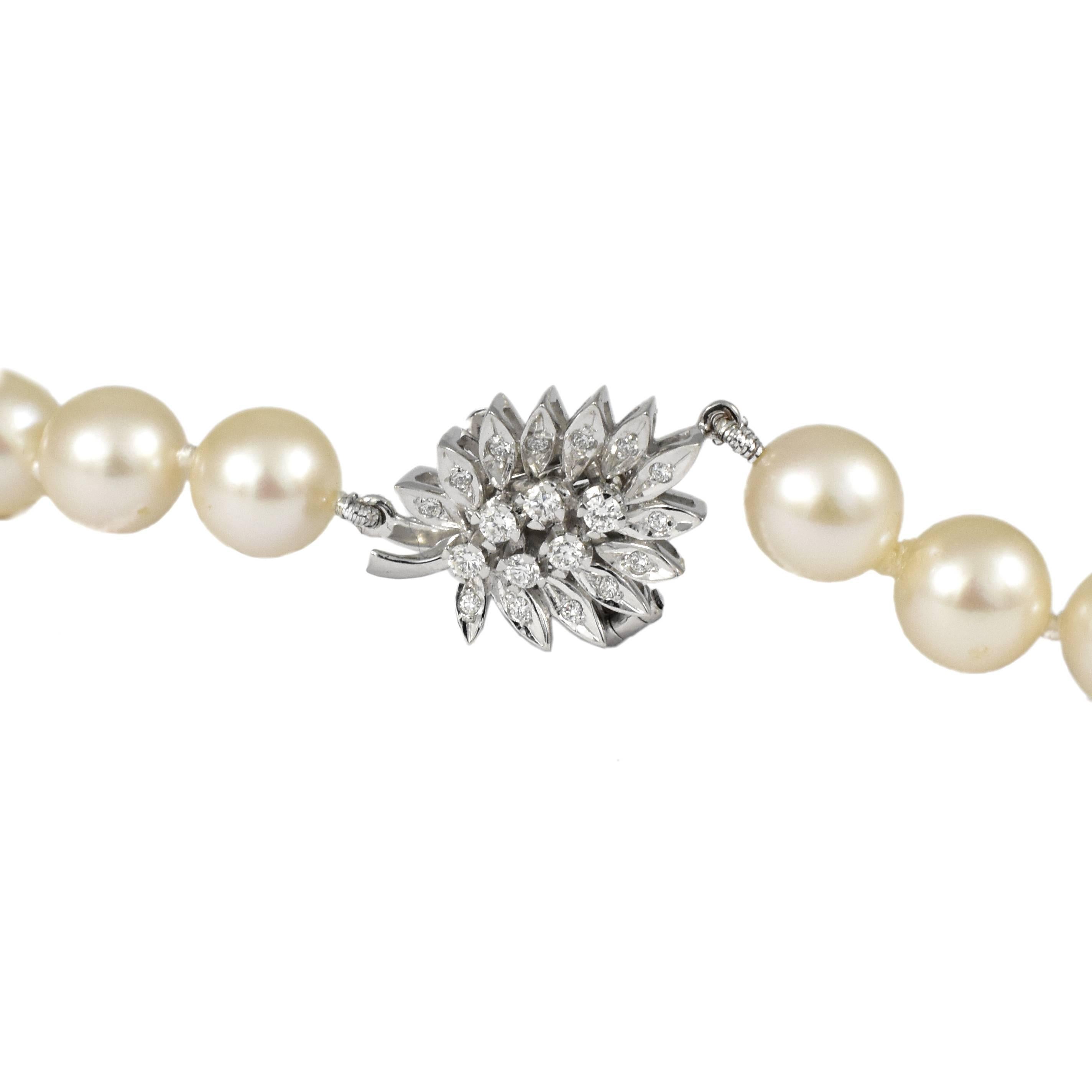 A Pearl necklace with a handmade Diamond White Gold Leaf design clasp. The solid 18 karat gold clasp is handmade in detail with a safety catch and set with diamonds. The pearls are single strand 6mm saltwater white, Princess length 20 inch, 50cm