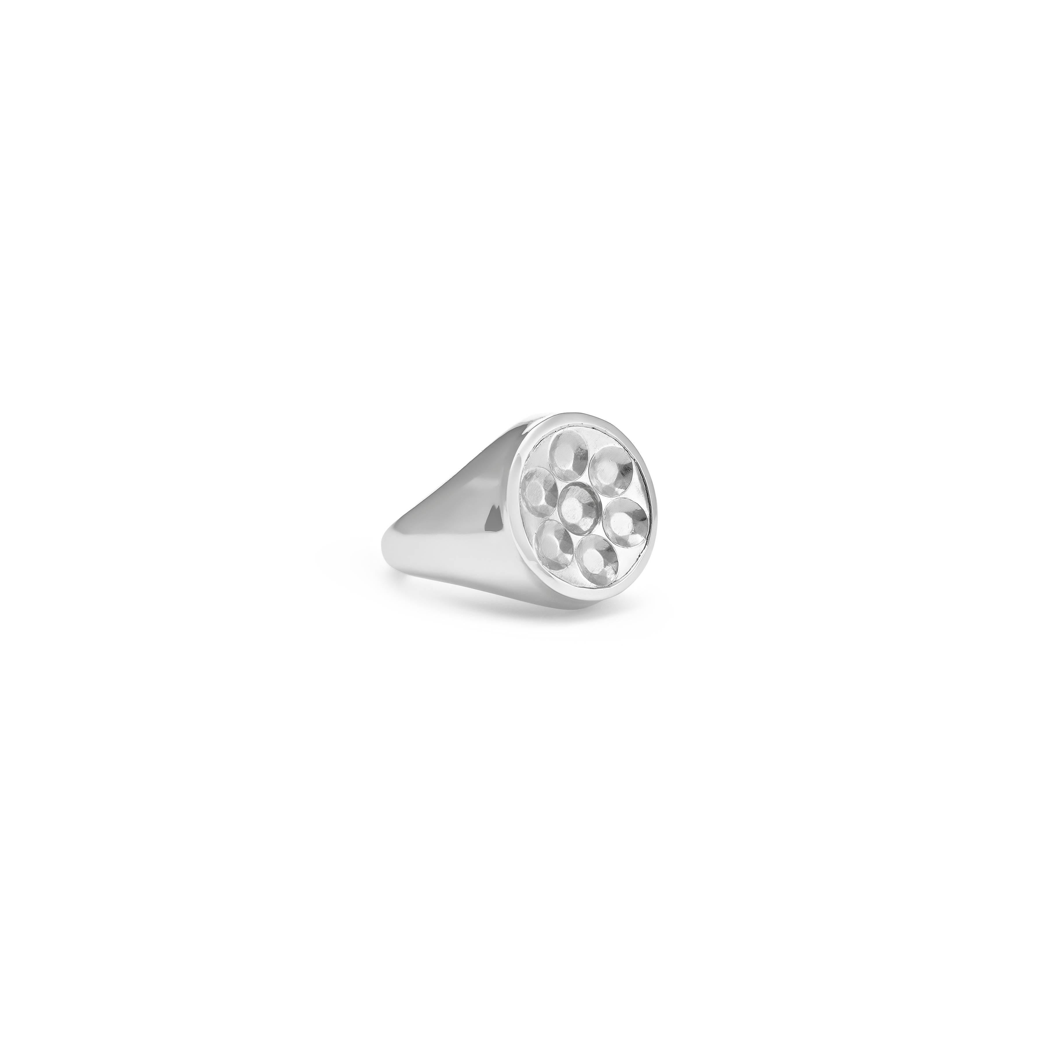 A contemporary take on a traditional male piece of jewellery with a femme twist. 
When the ring is pressed into hot wax it leaves behind not a family coat of arms but every girl's best friend - the impression of brilliant cut diamonds. 

Please