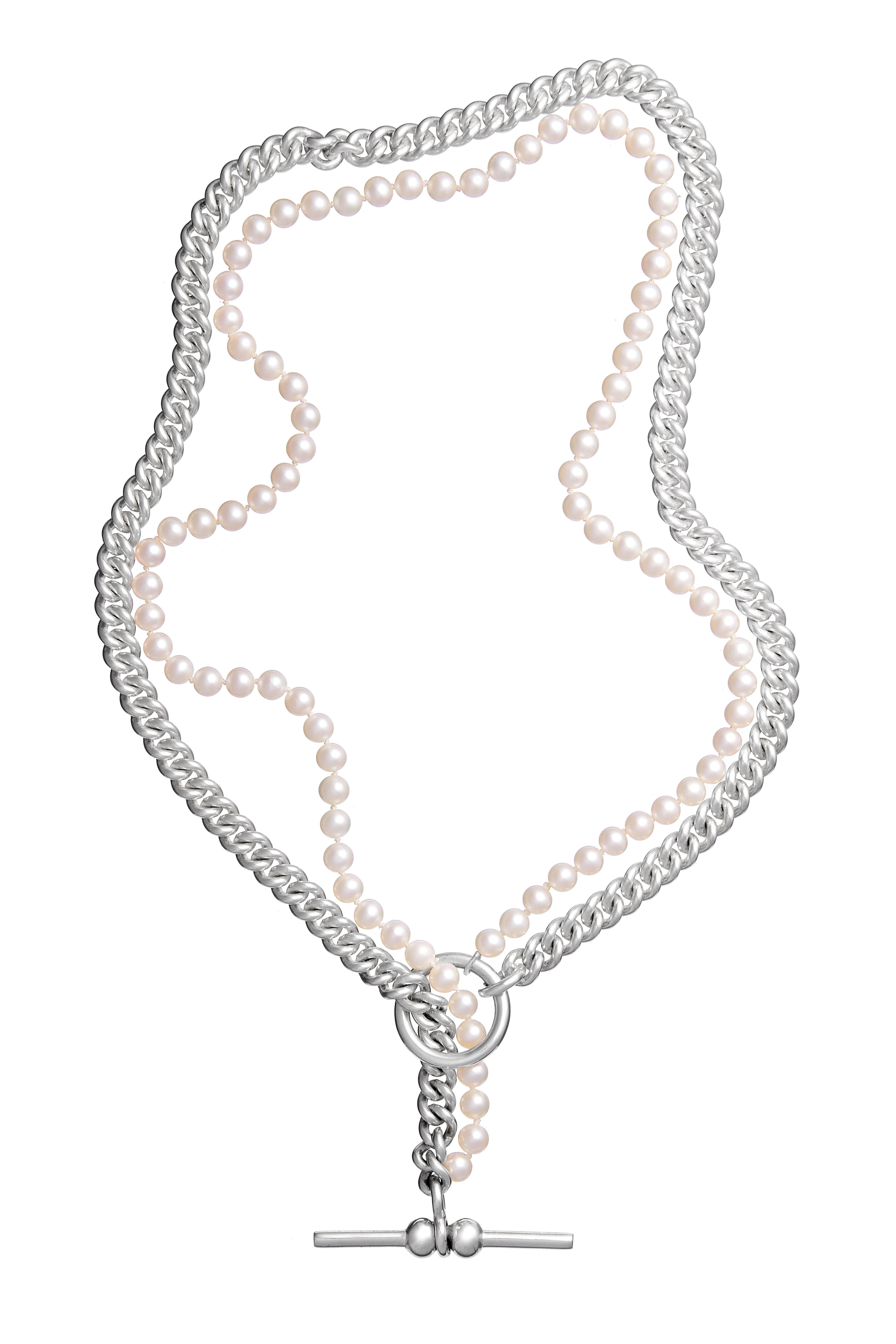 Combining 6mm silver curb chain traditionally found attached to antique pocket watches and pearls synonymous with female iconology, this statement necklace perfectly merges masculine and feminine elements into one balanced piece. 

All pieces are