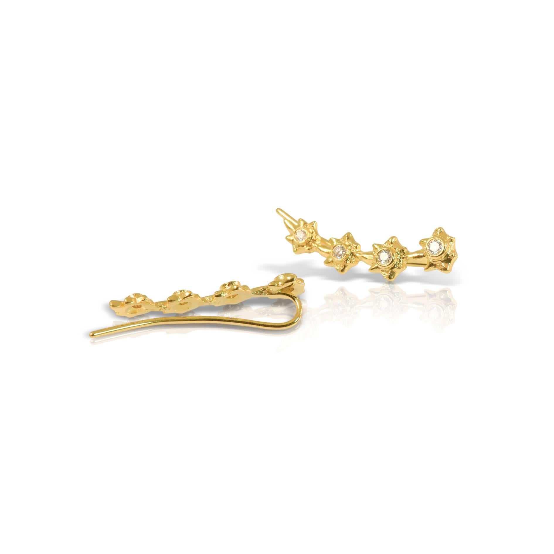 Earrings with flower motifs in 18k yellow gold and touches of diamonds from the Aurelia Collection. 
Depending on stock levels it may take 2 weeks to have the item ready to be shipped.
Price is for pair. Earrings can also be sold as a single