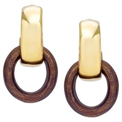 Boucles d
oreilles en or jaune 18 carats et palissandre