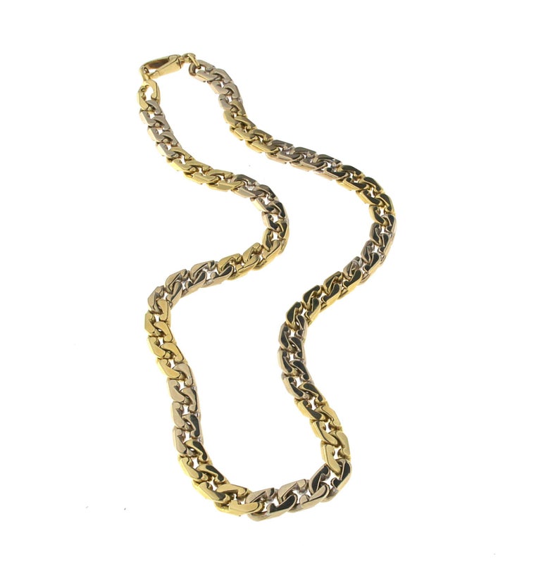 Chain necklace made by classic groumette jerseys in white and yellow gold alternating in three by three meshes and yellow gold clasp.
Total 18kt yellow gold weight: gr 69.20
