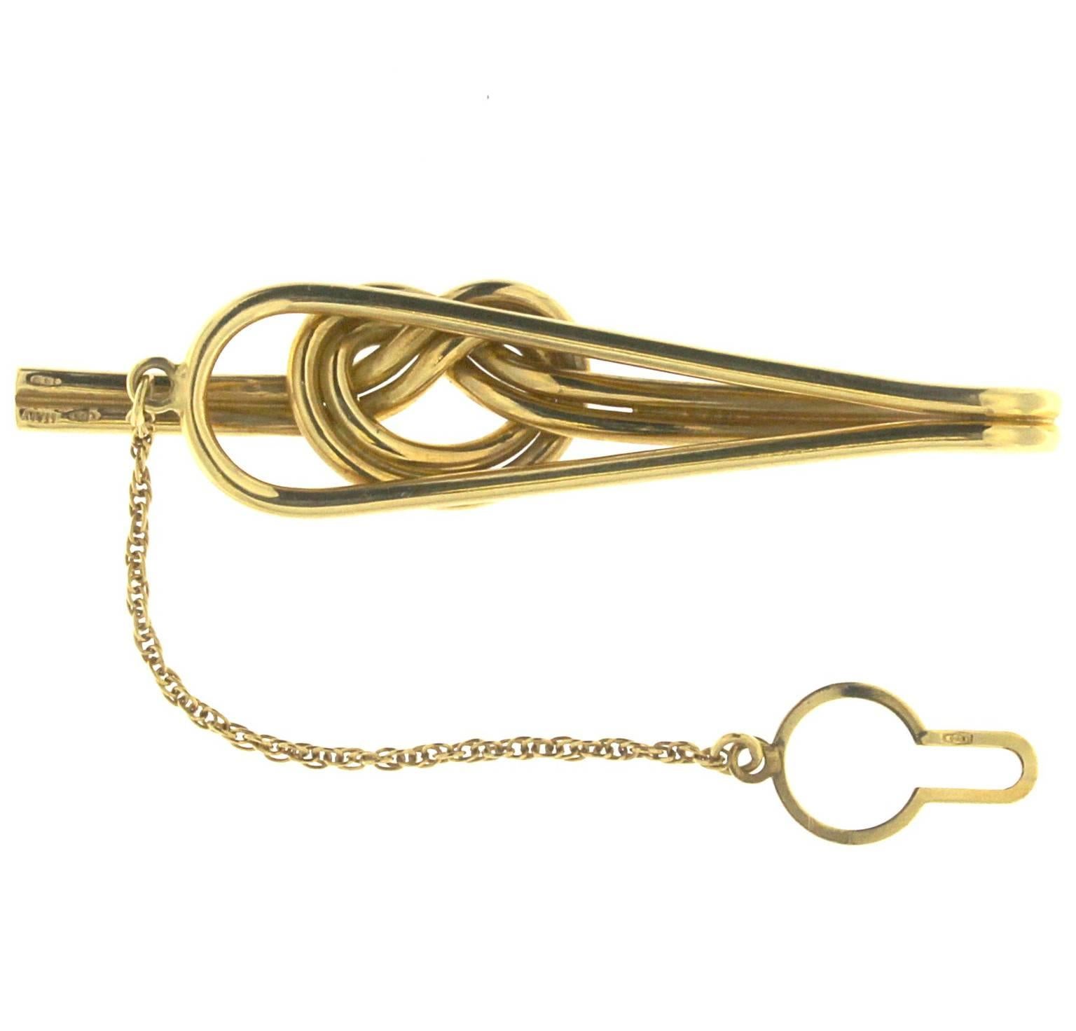 The Tie clip has been realized with 2 lines of yellow 18 kt gold mm 2.00 with a delicate chain (6 cm long) and at the end a classic button attachment 
Total 18kt gold weight: gr 16.90
Stamp: 10MI, 750
