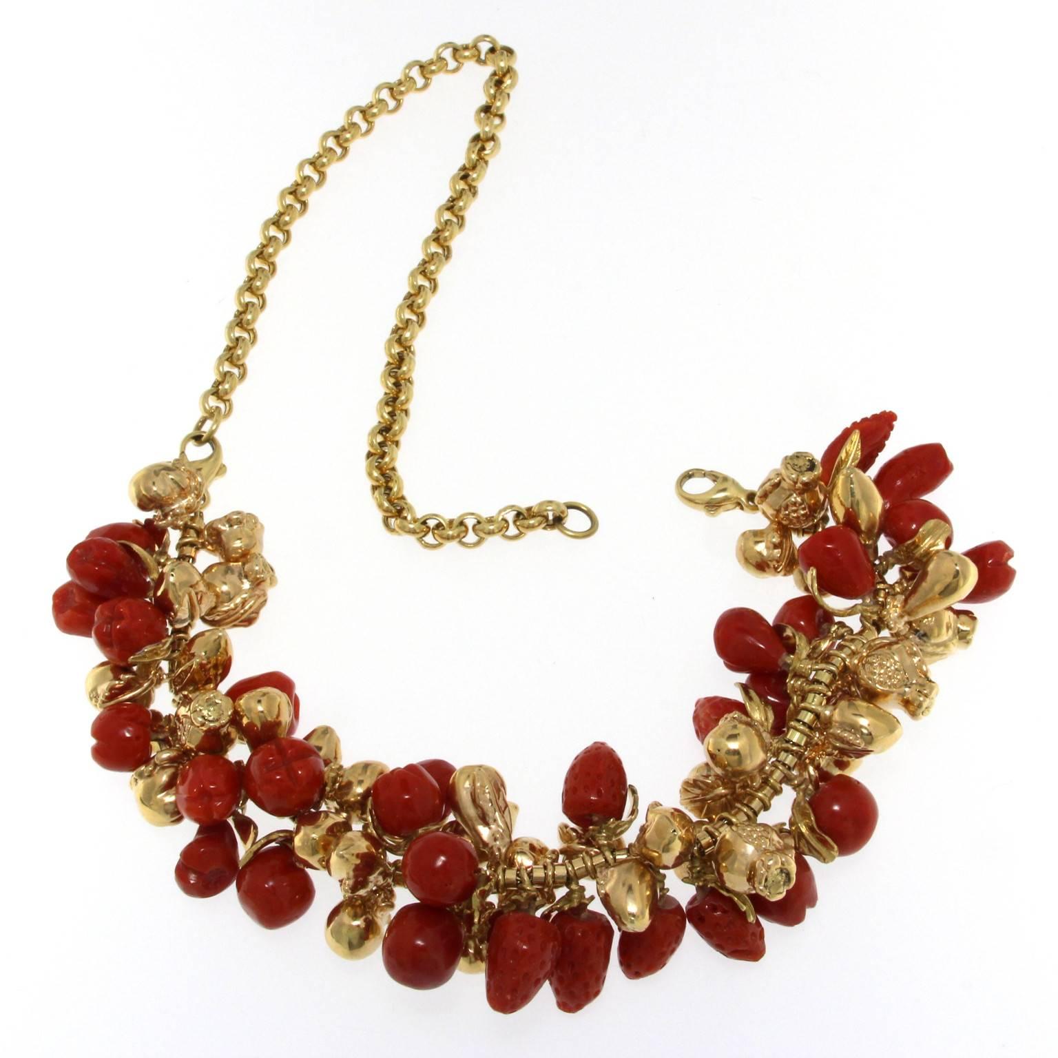 Coral and 18kt yellow gold fruit necklace
The front part can be worn as a bracelet taking out the back since it has 2 clasps. 
Total weight of 18 kt gold: gr 56.70
Total weight of red coral: gr 27.40
Stamp: 10 MI, 750, ITALY