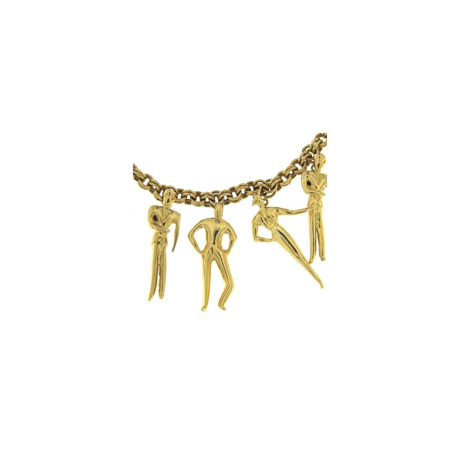This necklace was inspired by the fashion week of Milan
It has 10 different model differently dressed all in yellow gold
The total weight of the gold is gr 108.10
Stamp 750 10MI
