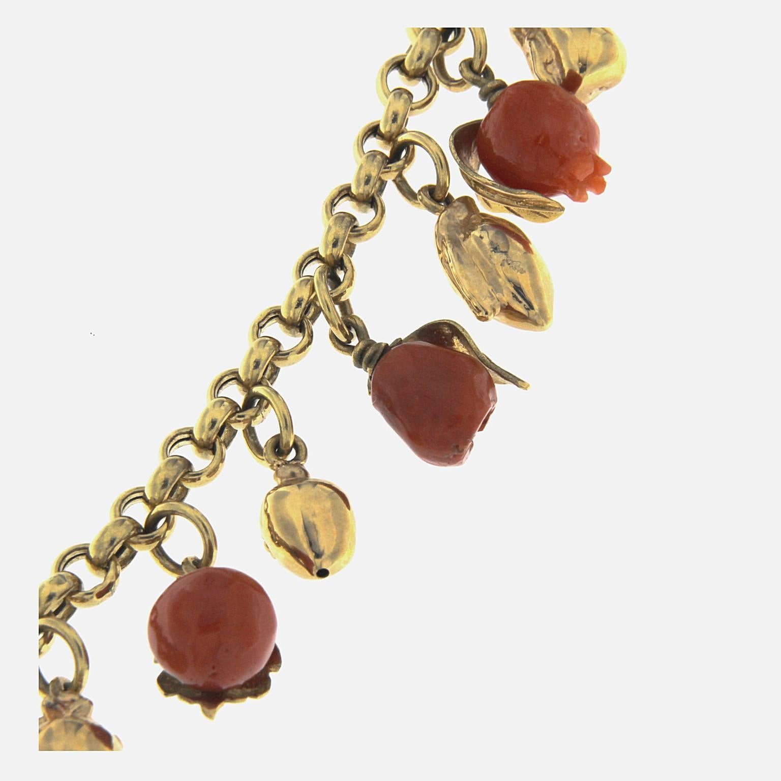 Coral and 18kt yellow gold fruit necklace

Total weight of 18 kt gold: gr 31.00
Total weight of red coral: gr 7.40
Stamp: 10 MI, 750, ITALY