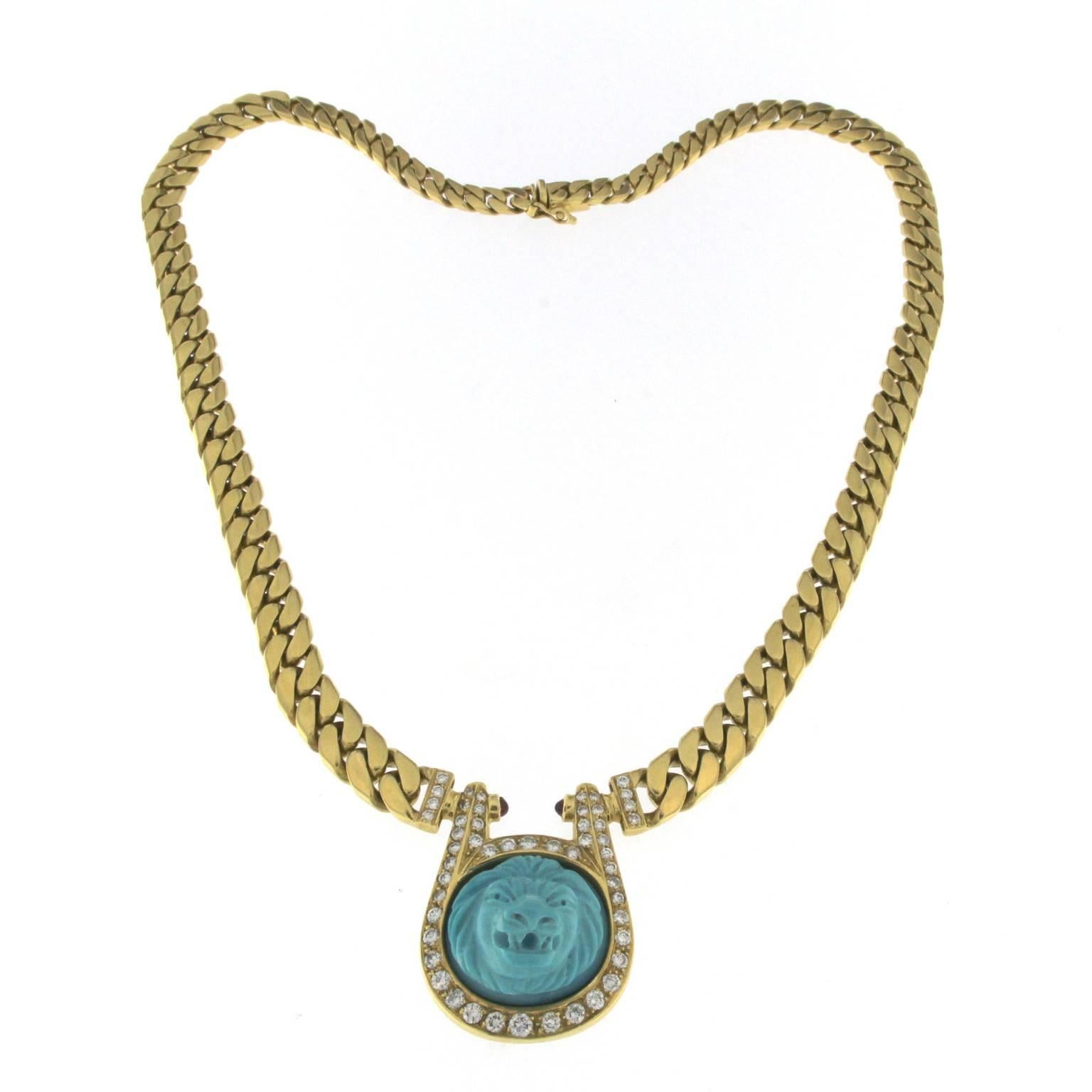 Turquoise centrale et diamants lion  dans un collier et des boucles d'oreilles en or 18 carats