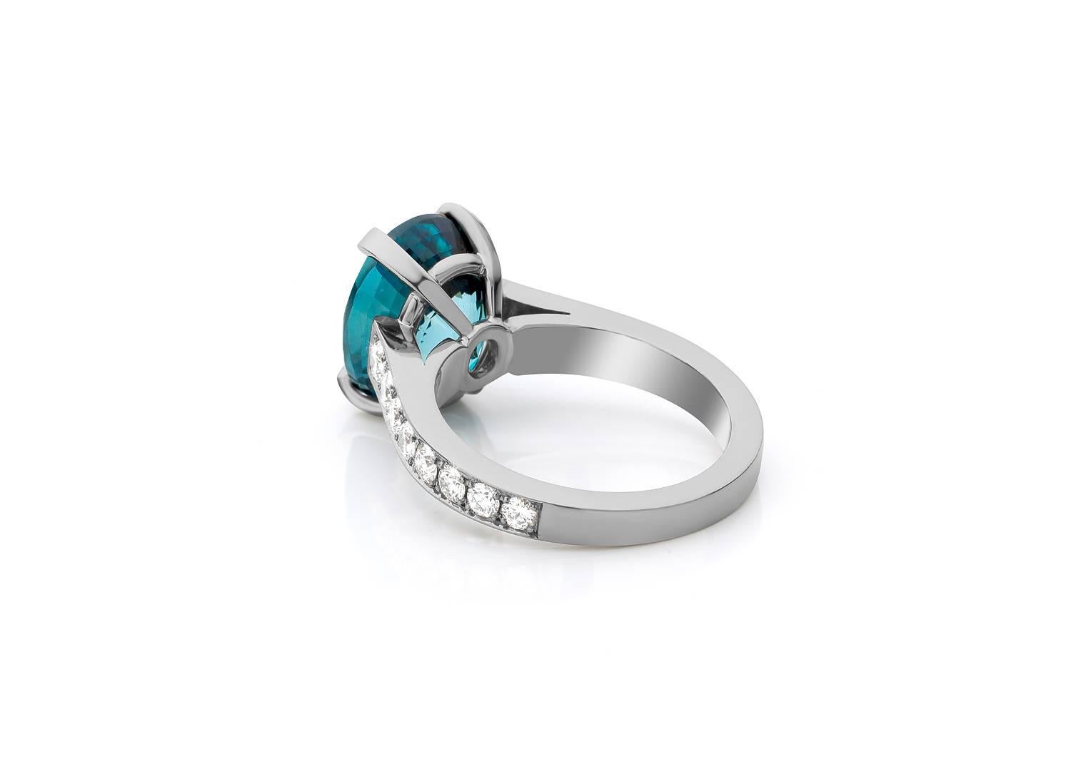 This ' special ' handmade Grey Gold ring is handset with a 11,22 carat blue natural Zircon and finished at the sides with 16 white diamonds. ( 0,80 carat )

The vivid blue in combination with the grey gold and white diamonds, makes it a very