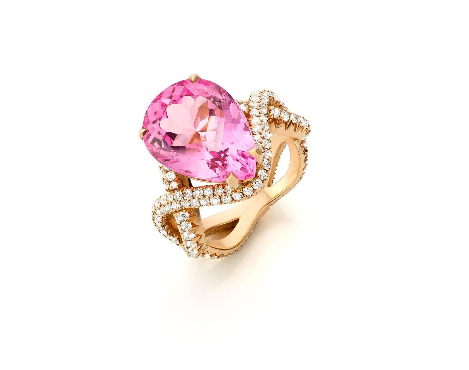 This rose gold eighteen carat ring is handset with a Madagascar vivid pink morganite. Morganite's in this color are very rare. 
The ring is set with diamonds of VVS1 quality and DEF color, all collection grade diamonds. 