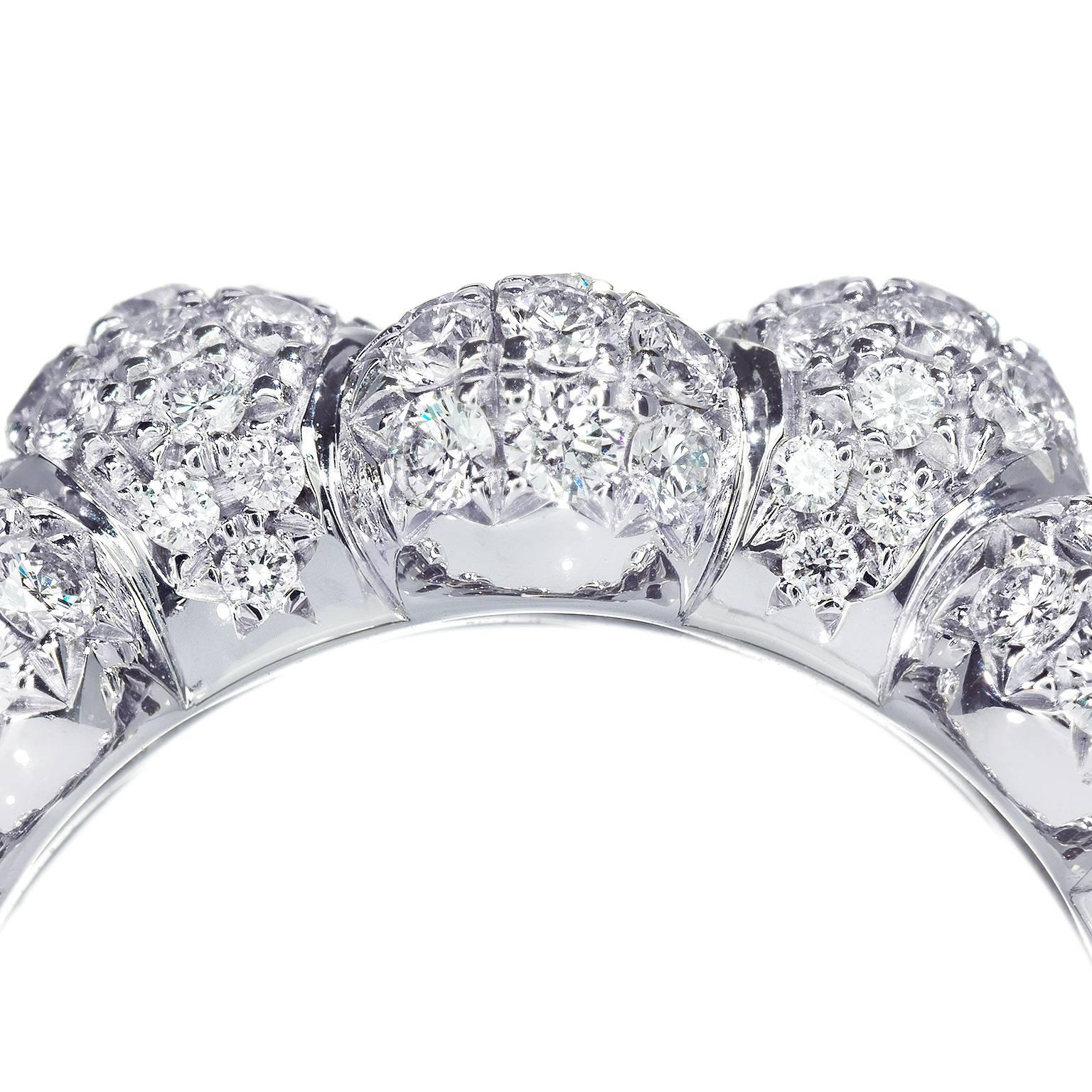 This beautiful pave-set 18 Karat white gold and diamond right hand, or cocktail, ring designed by Towe Norlen in 2009, has 328 hand set brilliant-cut Top Wesselton (TW vvs) high quality diamonds. In total 3.98 Carats. 

The Celeste ring is composed
