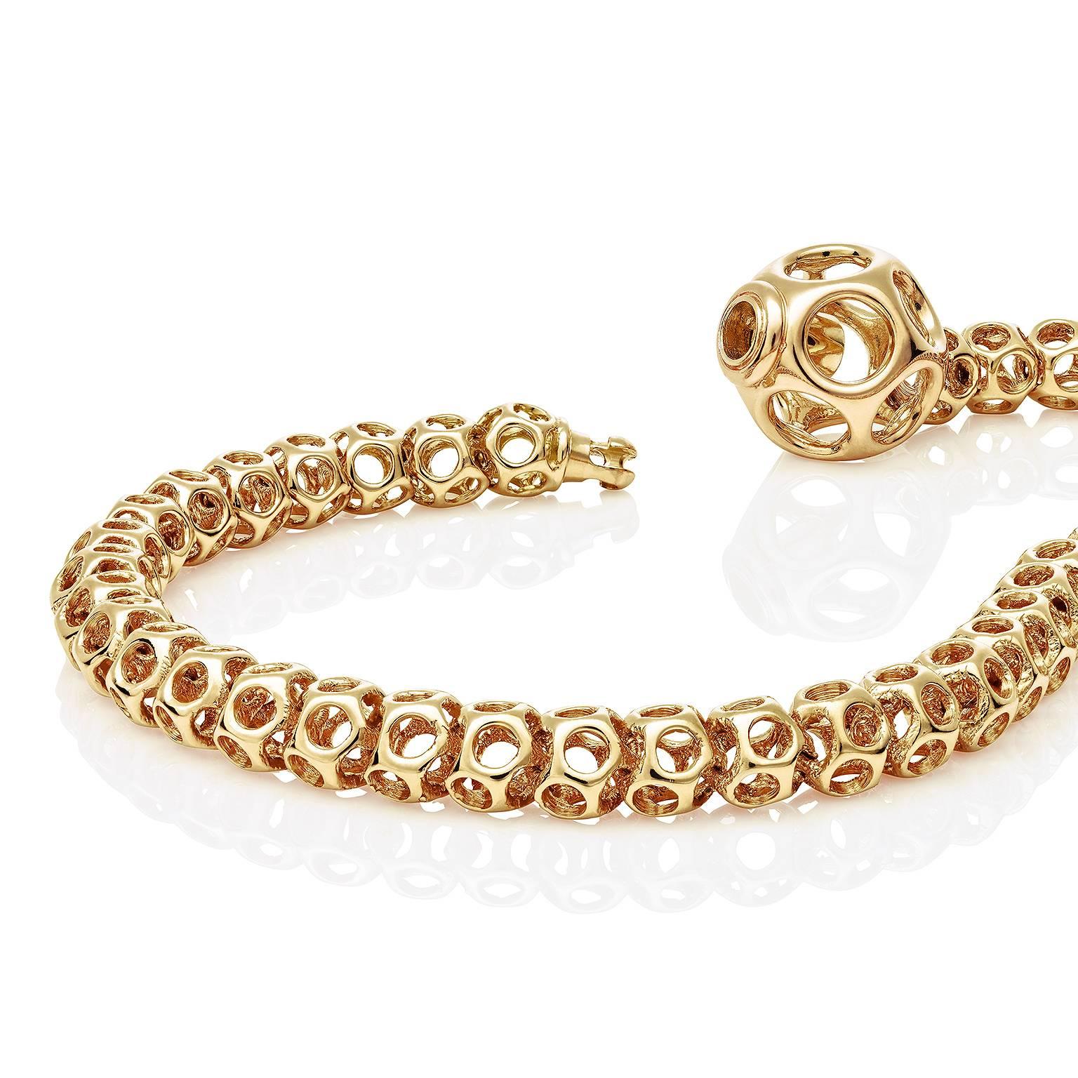 This ultra modern unique chain bracelet in 18 Karat yellow gold designed by Towe Norlen in 2005, is made by the high-tech free form fabrication method laser sintering of gold. The special link system makes this chain highly flexible and comfortable.