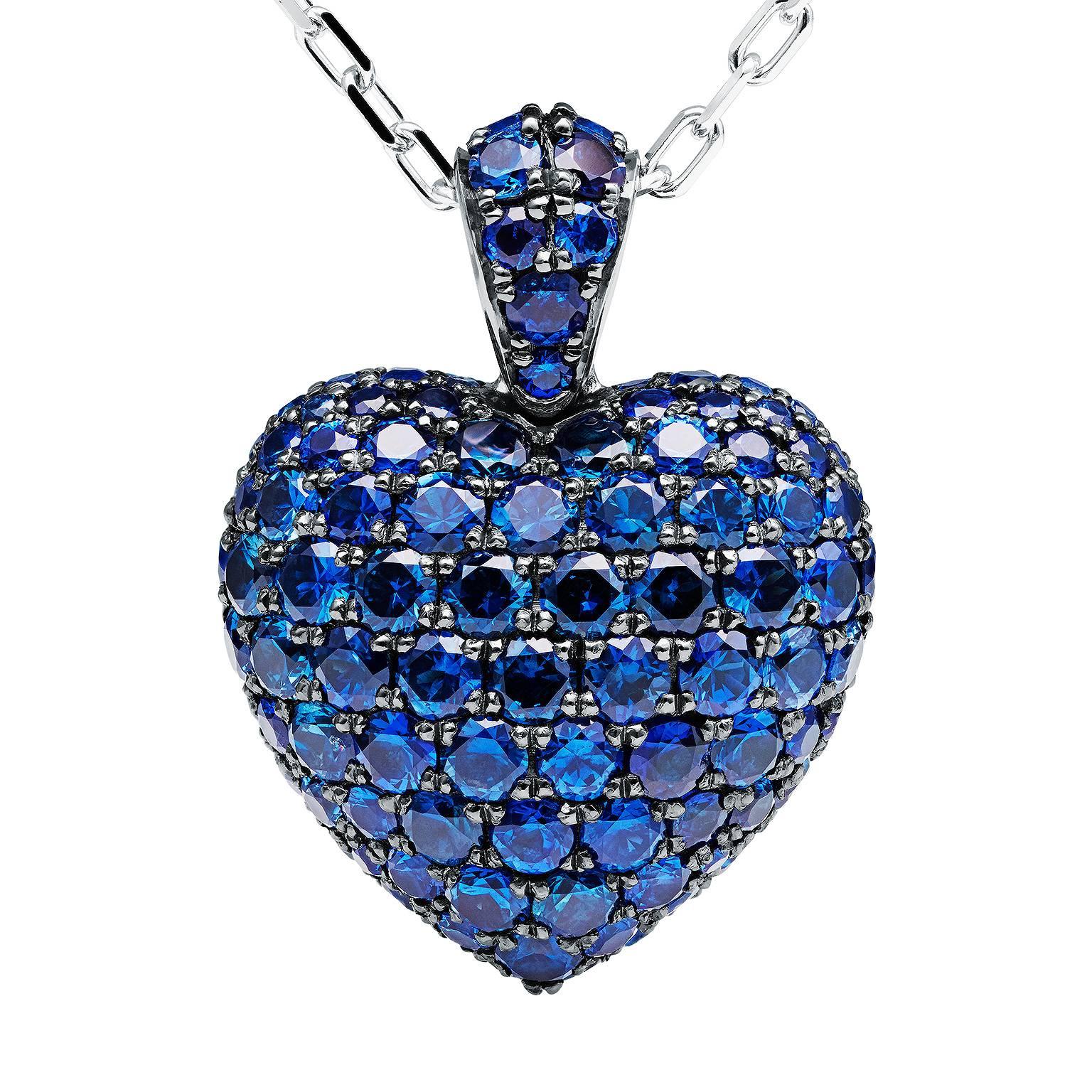 This lovely cornflower blue sapphire heart pendant designed by Towe Norlen in 2009, is shaped as a perfectly curved heart with a prominently rounded body. 179 sapphires, hand picked for their matching beautiful blue colour and perfect quality, are