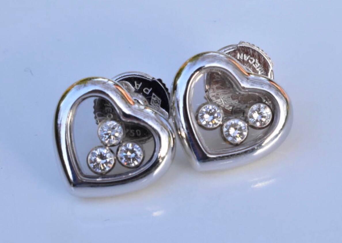 A Chopard Happy Diamonds Icons Earrings set in18k white gold. Each earring features 3 free moving diamond under a heart shaped sapphire glass.
Retail Price £3,360
Diamond weight: 0.30 Carat
Hallmarked: Chopard 9124719-83 / 4611
Gross total weight: