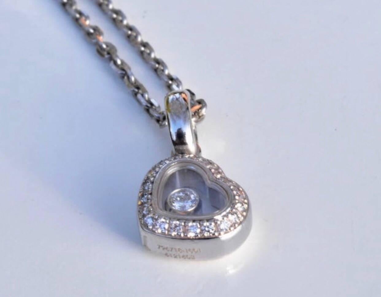 A Chopard Happy Diamonds ring and necklace set in18K white gold. Both items features a heart with a surround of diamonds with one free moving diamond under a sapphire glass.
Hallmarked: Chopard 82 / 6718-6097114 and 796718-1001-6121603
Ring size: UK