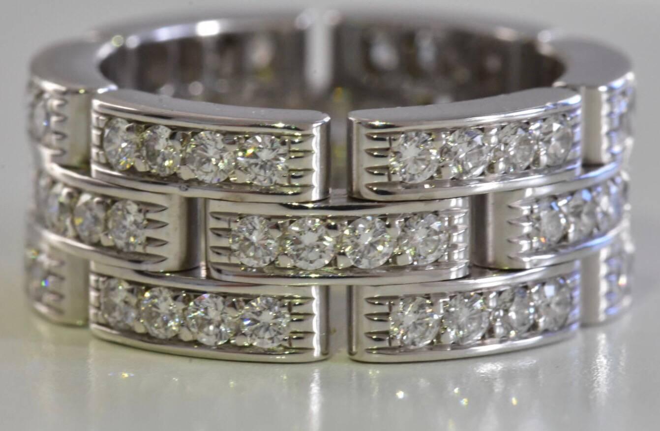 A Cartier Maillon Panthere ring set in 18k white gold. The ring features three rows of pave brilliant cut diamonds of approx 1.37 carat. 
Retail price £13,200 large full diamond Maillon Panthere.
Sold with Cartier ring box. 
Ring Size: 4 1/4 EU