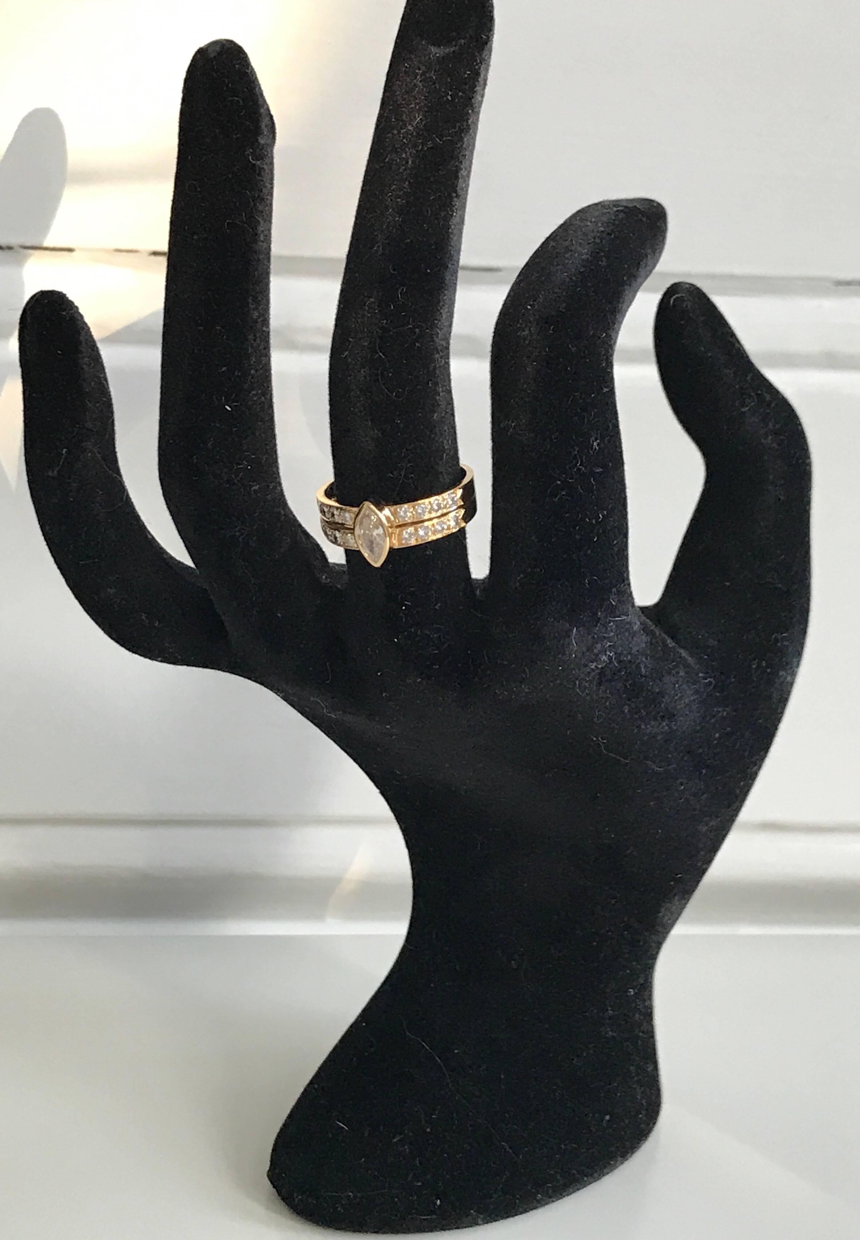 A vintage Cartier diamond ring set in 18k yellow gold. The ring features a centre marquise diamond of approx 0.20 carat set to a half-diamond band with 16 brilliant-cut round diamonds of approx 0.32 carat
Ring size: UK N, US 6 1/2 , EU