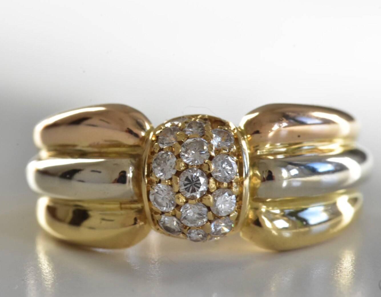 A vintage Cartier diamond tri-colour ring set in 18k gold. The ring features a central ball set with pave brilliant-cut round diamonds set to a yellow, white and rose gold band.
Ring size: UK L, US 5 1/2 EU 51
Measurements: ring top is 8mm