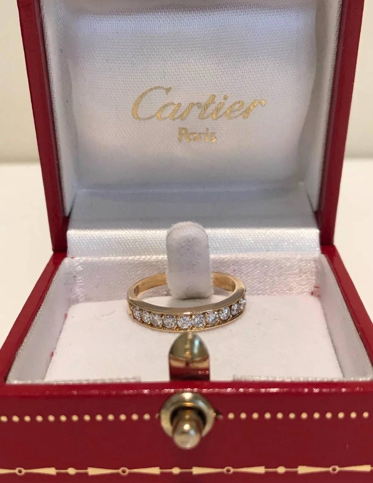 A Cartier classic wedding eternity ring set in 18k yellow gold. The ring features twelve brilliant cut round diamonds of approx 0.50 carat weight. Fully hallmarked Cartier 750 52-941956
Diamond weight: approx 0.50 carat
Weight: 1.9 grams 
Size: UK M
