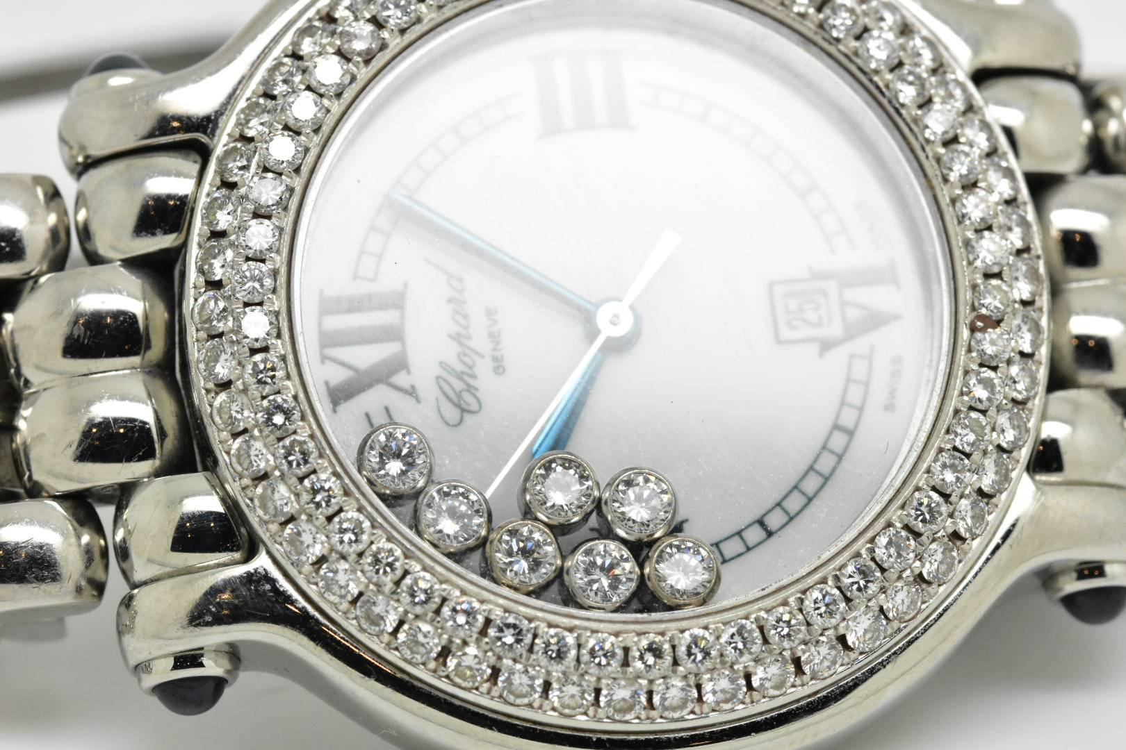 Chopard Happy Sport Classic 32mm round diamond bezel watch with 7 floating diamonds 
Reference 27/8236-3005 serial number 1355378TT 
32mm round stainless steel case (32mm diameter, 8.5mm thickness) with a stainless steel bezel set with 80 diamonds