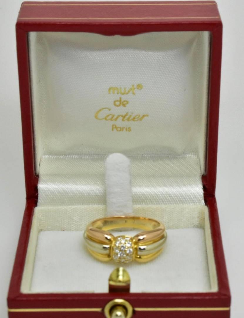 A vintage Cartier Tri- Colour Diamond ring set in 18k white, yellow and rose gold. The ring features fifteen brilliant cut diamonds of approx .25 carat set to tri-colour band of graduating size.
Size M / 53
Weight 5.5 grams 
Hallmarks - Cartier 750