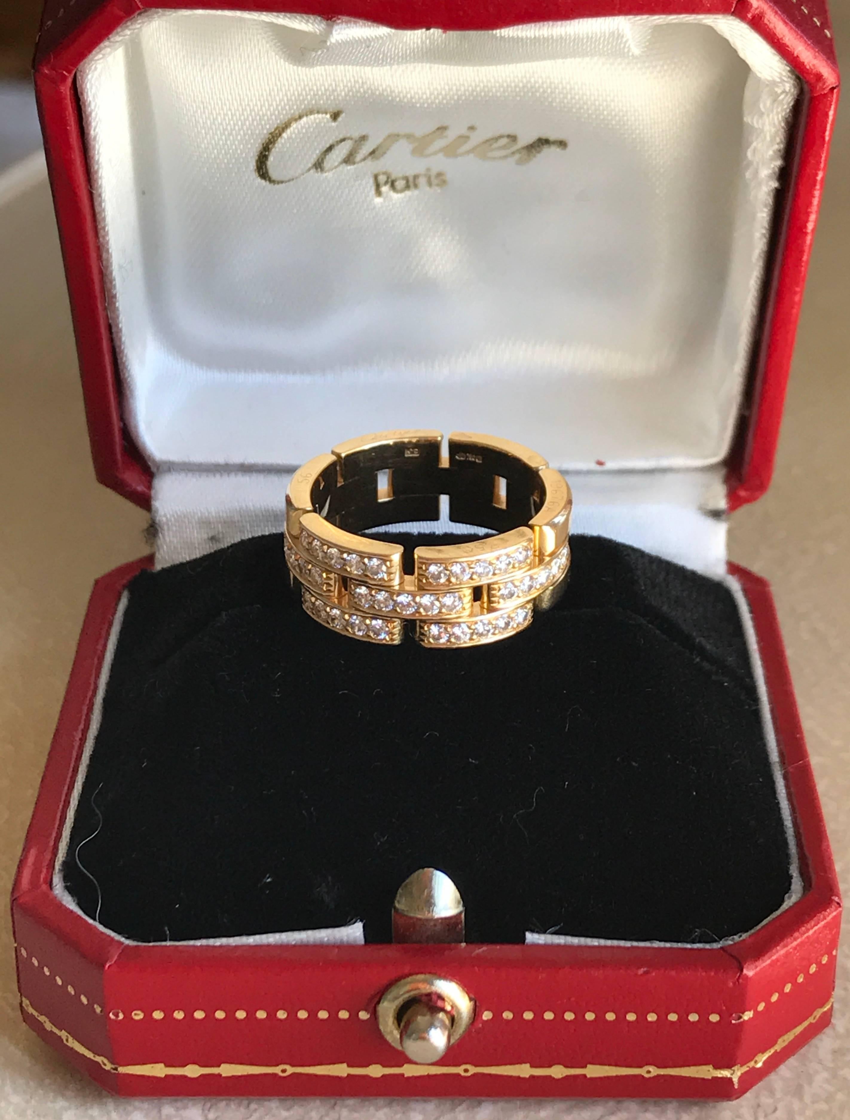 Cartier Maillon Panthere three row half diamond ring set in 18k yellow gold. The is from the Cartier Panthere Links & Chains collection and features 35 pave set brilliant cut round diamonds in a link style band. The ring currently retails on