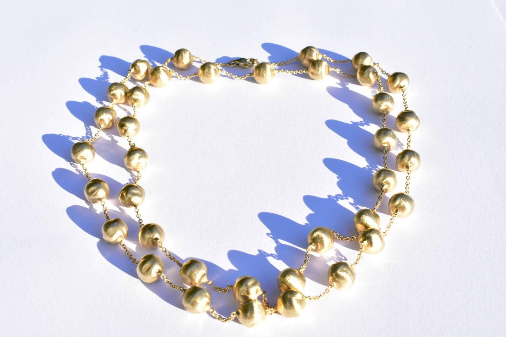 Marco Bicego beaded necklace from the 'Africa Collection' set in 18k yellow gold. The necklace features thirty rounded beads measuring approx 8x8 mm set to a chain of approx 15.35 inches in length. 
Weight 33.8 grams 
Hallmarked: 750 Bicego 1021V1
