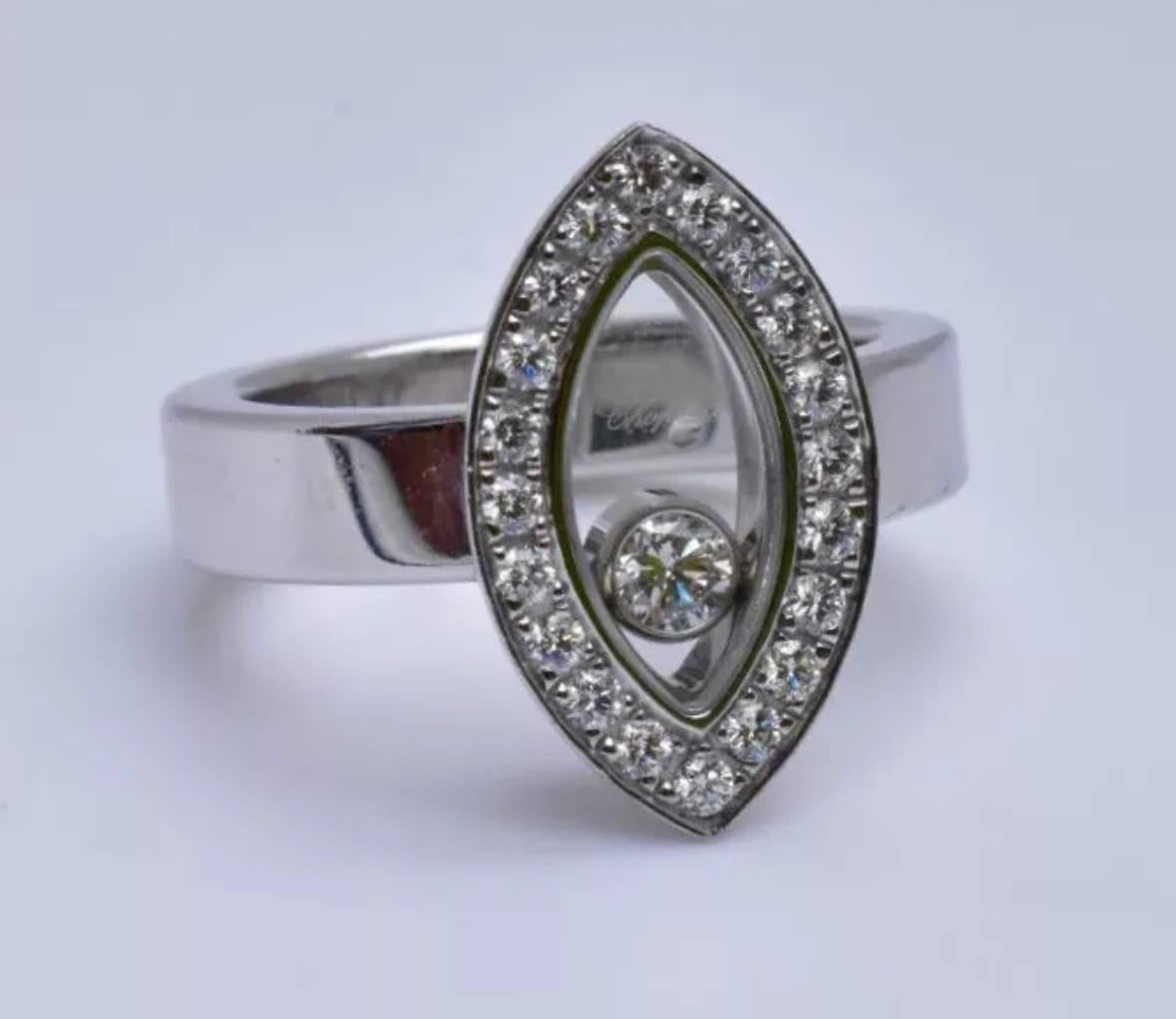 
A Chopard Happy Diamonds Ring set in 18k white gold. The ring featurins a floating round-cut diamond, weighing approximately 0.05 carats, in a marquise-shaped frame, set with 20 round brilliant-cut diamonds, weighing a total of approximately 0.30