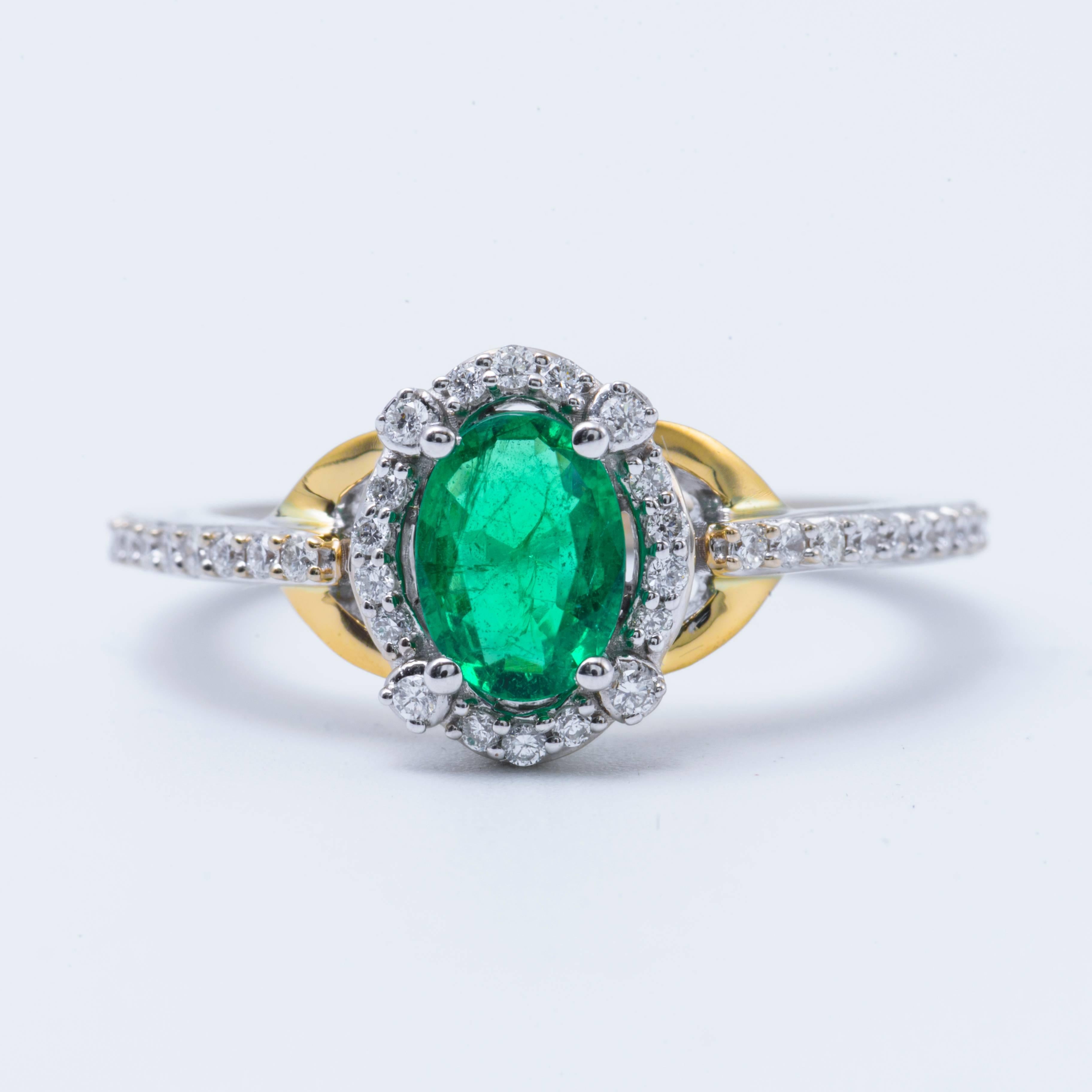 14 K white and yellow gold ring. The Zambian emerald measures 7x5 mm for a weight 0.71 cts. and the diamonds weight is 0.20 cts. with H Color and SI Clarity.
Size of ring : 6.5 ( Can Be Sized)
