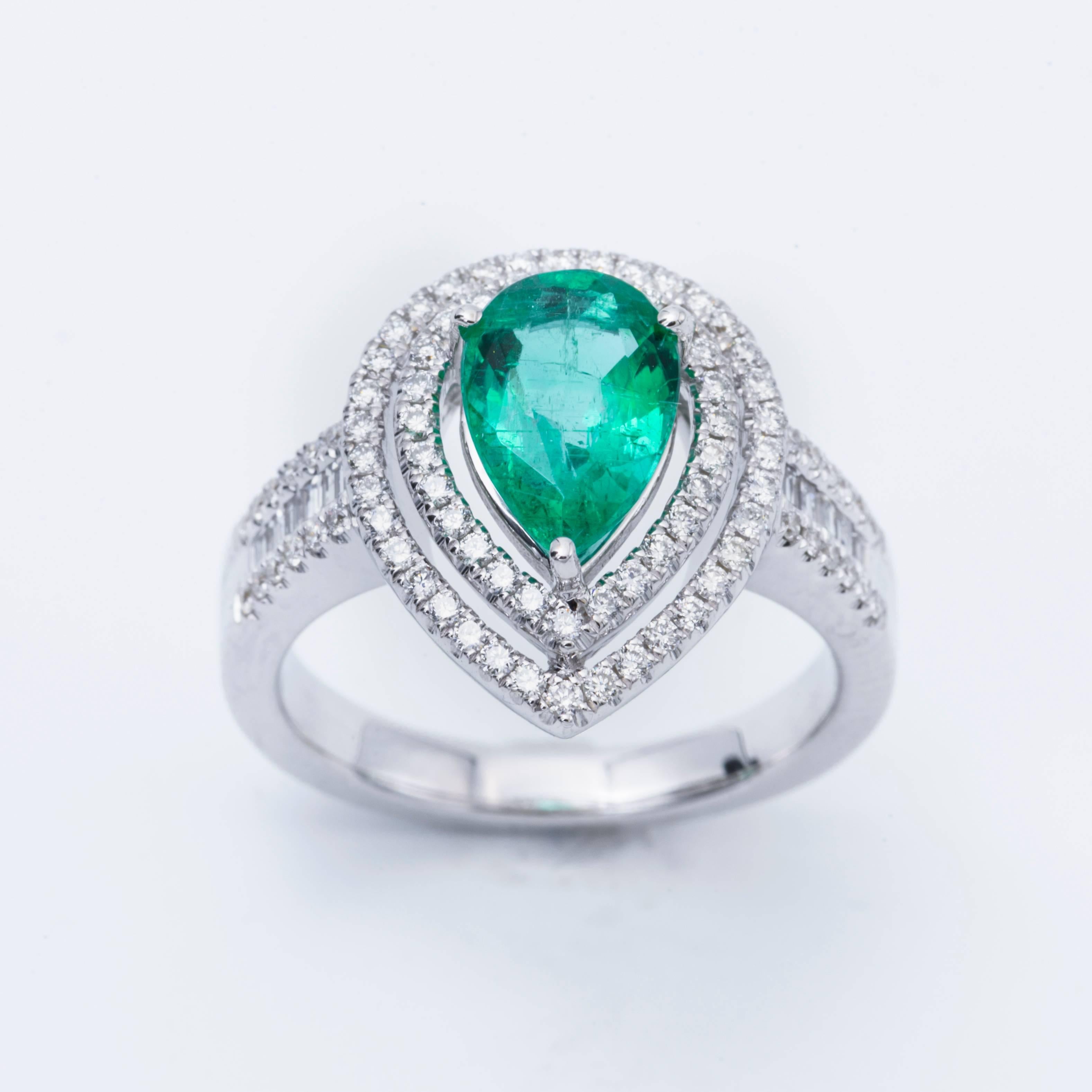 Style: 18k White Pear Shape Emerald  Diamond Halo Engagement Ring
Material: 18k White Gold
Gemstone Details: 1 Pear Shape Emerald approximately 1.52 ct. 9x7 mm
Diamond Details: Approximately 0.65ctw of diamonds. Diamonds are G/H in color and SI in