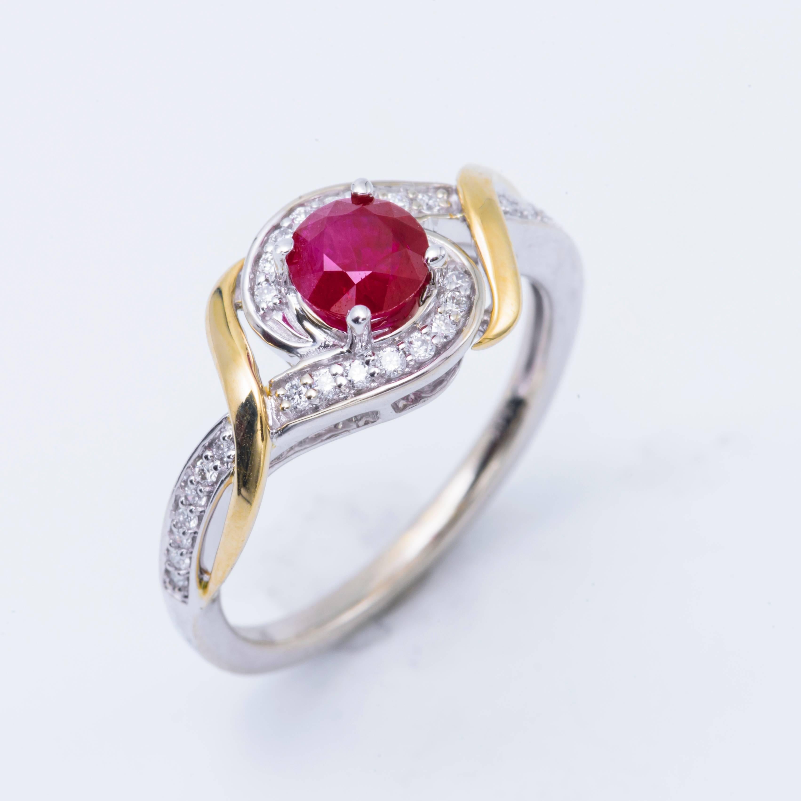 14k White/Yellow Gold  Round Shape Ruby  Diamond Halo Engagement Ring
Material: 14k White/Yellow Gold
Gemstone Details: 1 Round Shape Ruby approximately 0.54ct. 5 mm
Diamond Details: Approximately 0.15ctw of diamonds. Diamonds are H in color and SI