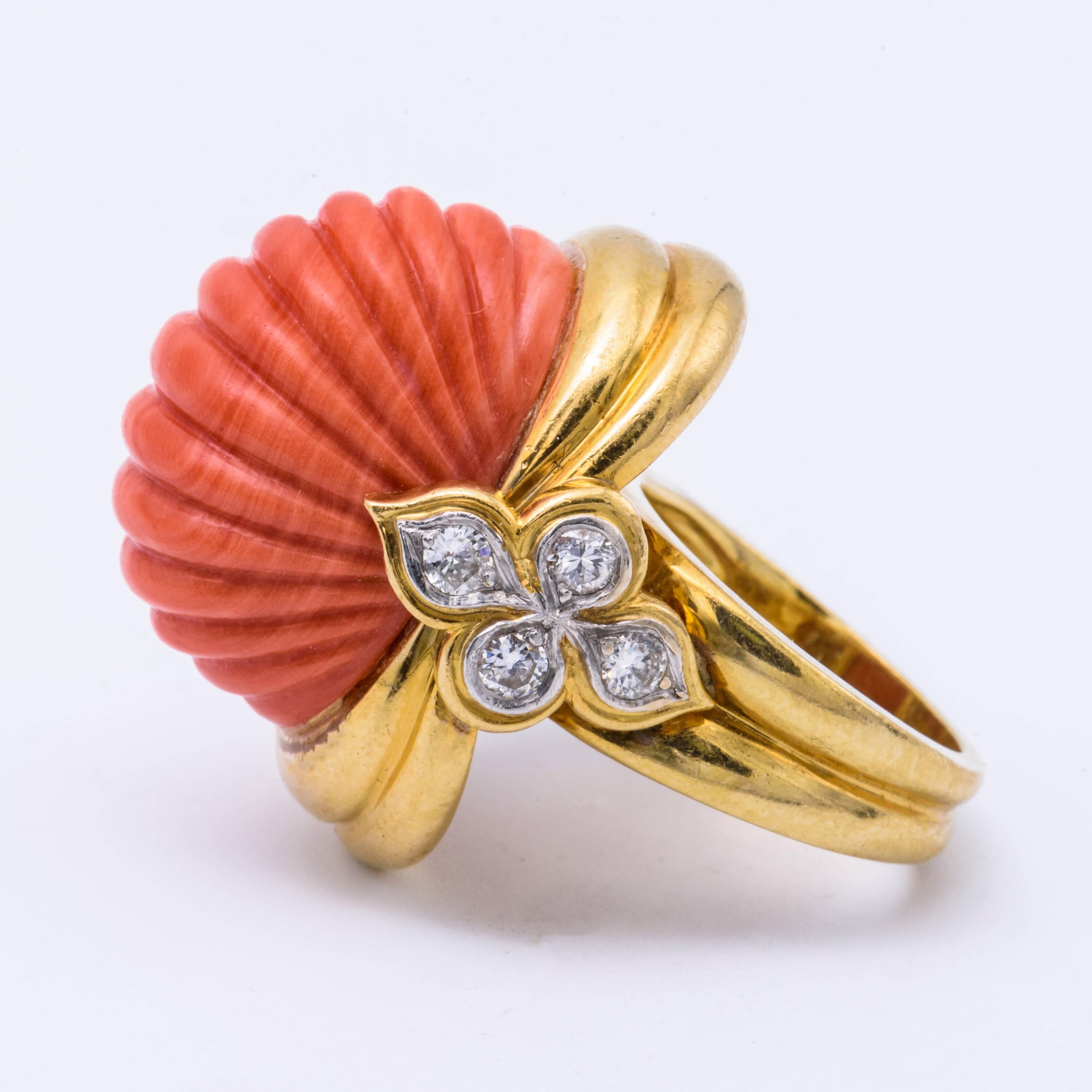 1960's E.Pearl Natural Coral Ring Signed E.Pearl in 18K  yellow gold With 8 diamonds and the ring weight is 19.3 dwt