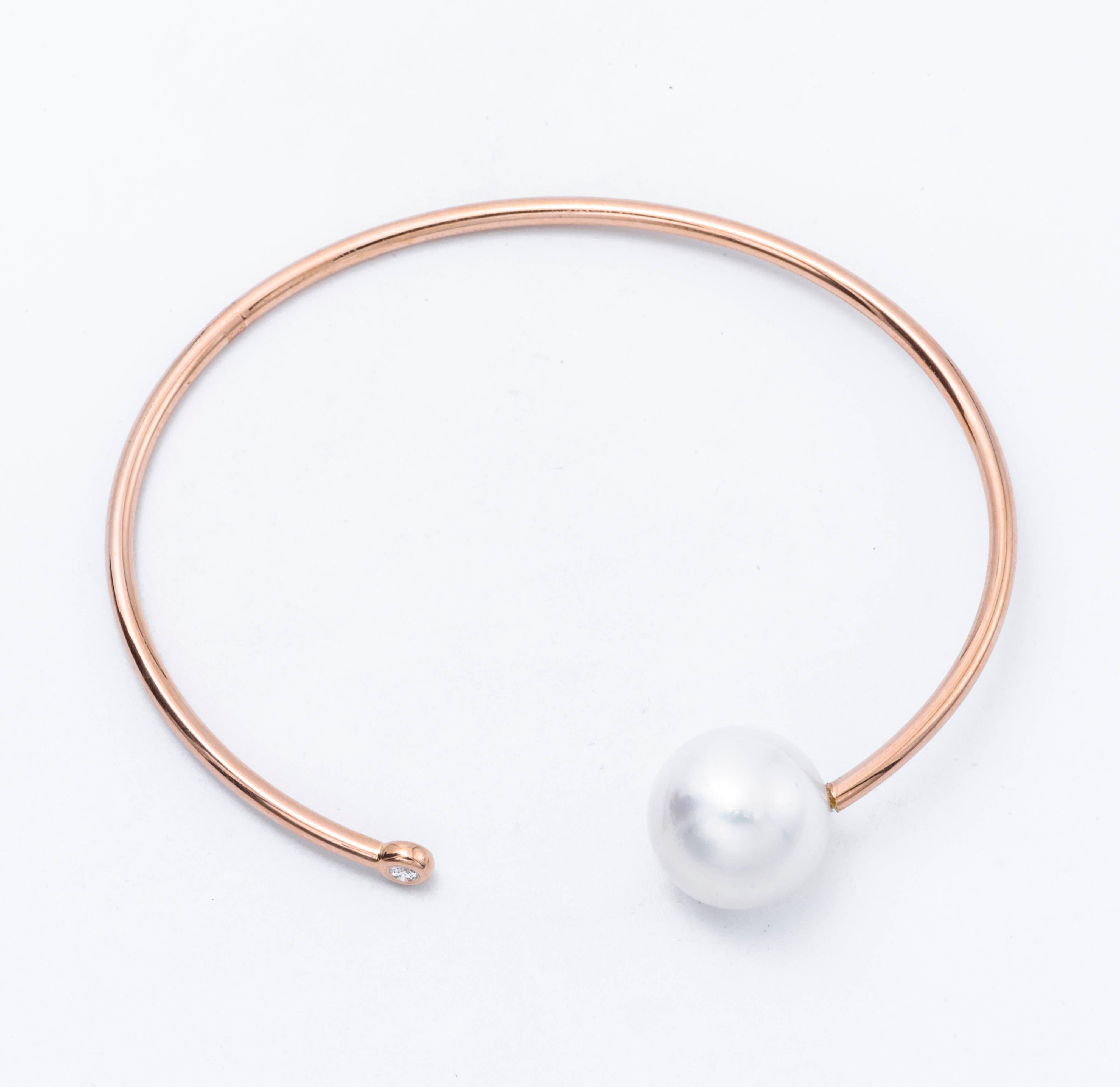 18K Rose gold open bracelet featuring one South Sea Pearl measuring 11-12 mm and one diamond weighing 0.06 Carats.
Color G-H
Clarity SI

Pearls can be changed to Pink, Tahitian or Golden upon request. Price subject to change.
