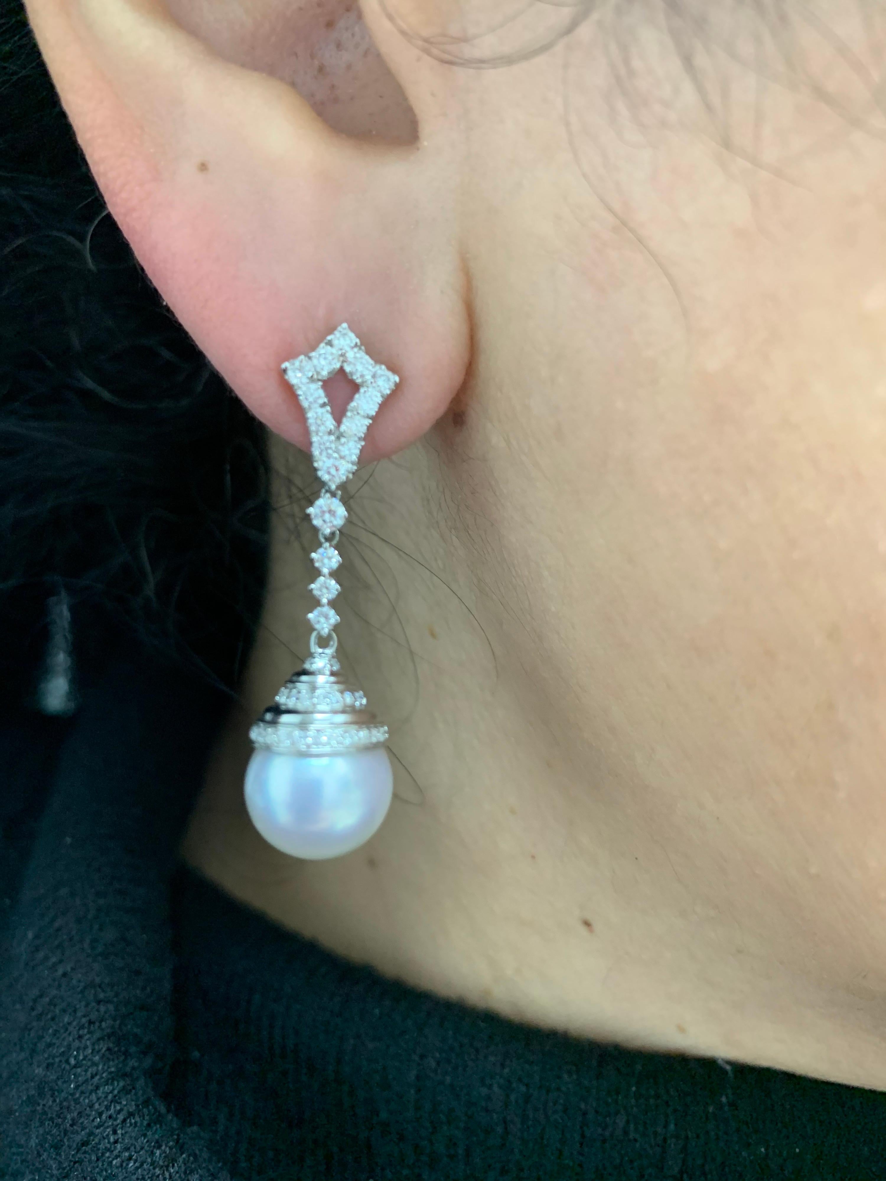18K White gold drop earrings featuring two South Sea pearls measuring 11-12 mm with 82 round brilliants weighing 0.90 carats.

Pearl Quality	AAA
Luster	AAA, Excellent
Nacre	Very Thick