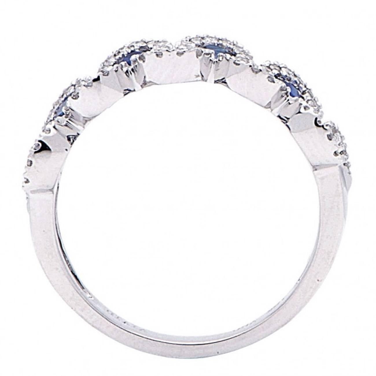 This Stunning Ring Features:
18K White Gold
1.32 Total Cts. Weight.
Diamonds: Round
Diamond Weight: 0.43 Cts.
Diamond Count: 90
Diamond Color: G+
Diamond Clarity: SI1+

Round Sapphire: 9
Sapphire Weight: 0.89 Cts.
Diam. Clarity: