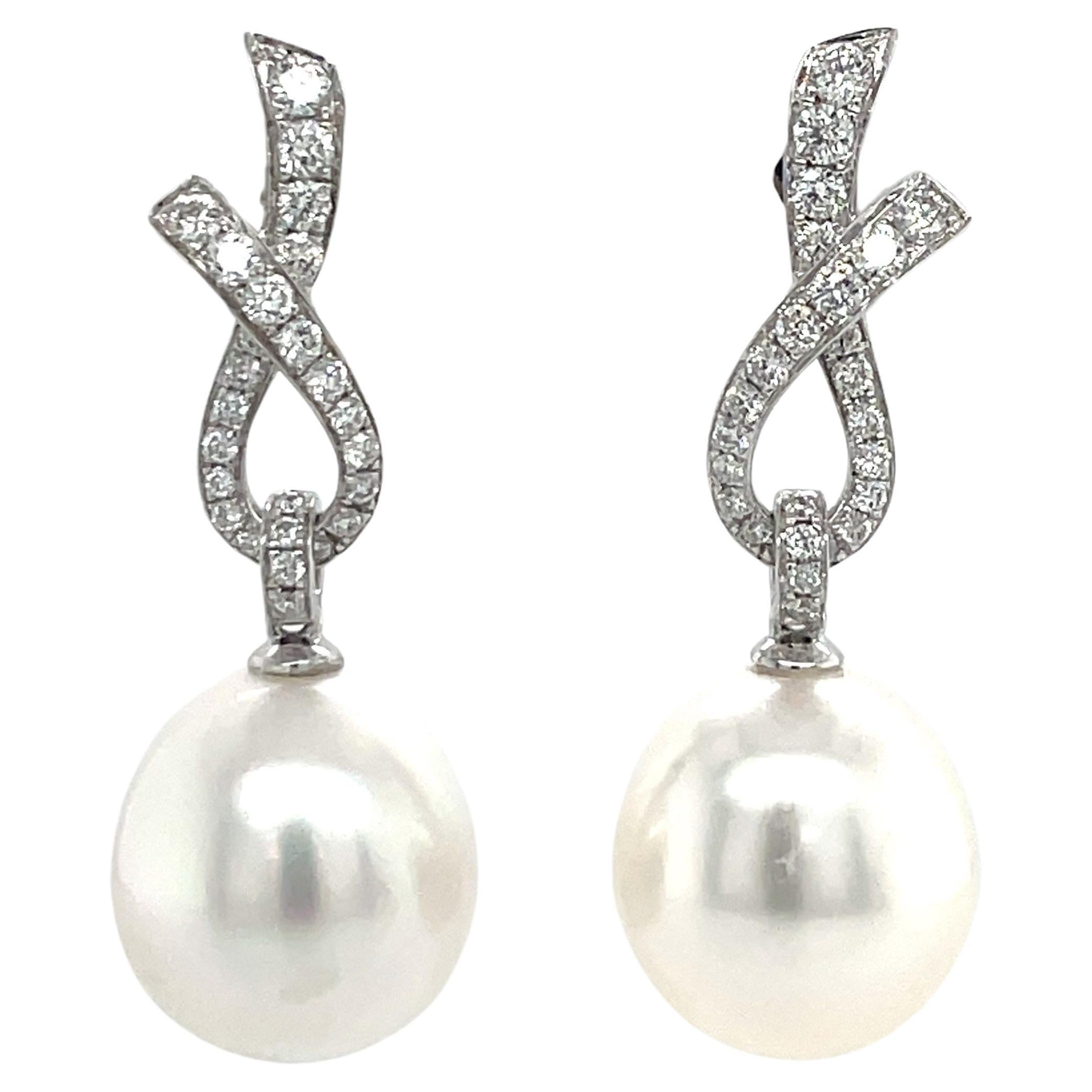 18 Karat White Gold Diamond Ribbon South Sea Pearl Earrings .057 Carats For Sale