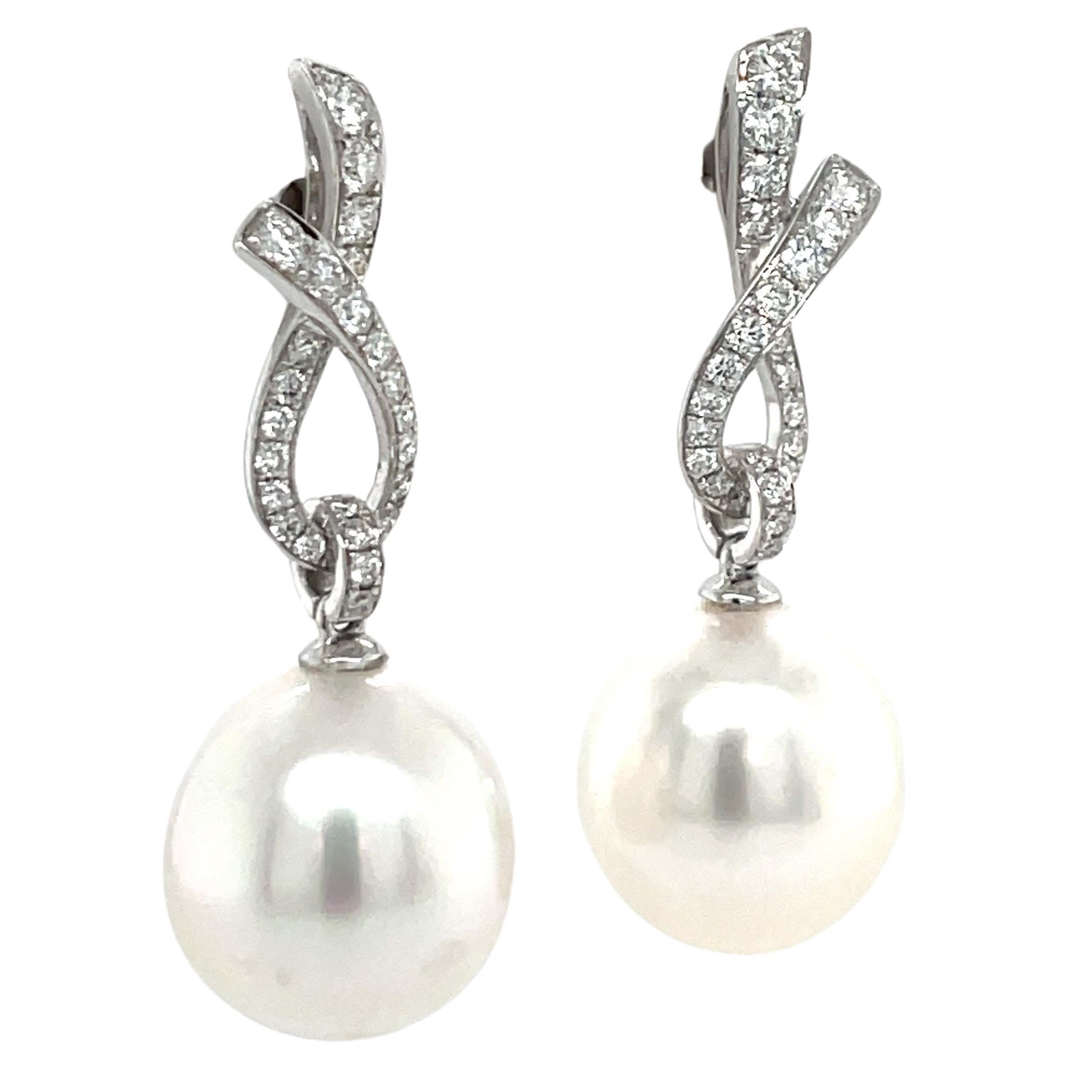Contemporary 18 Karat White Gold Diamond Ribbon South Sea Pearl Earrings .057 Carats For Sale